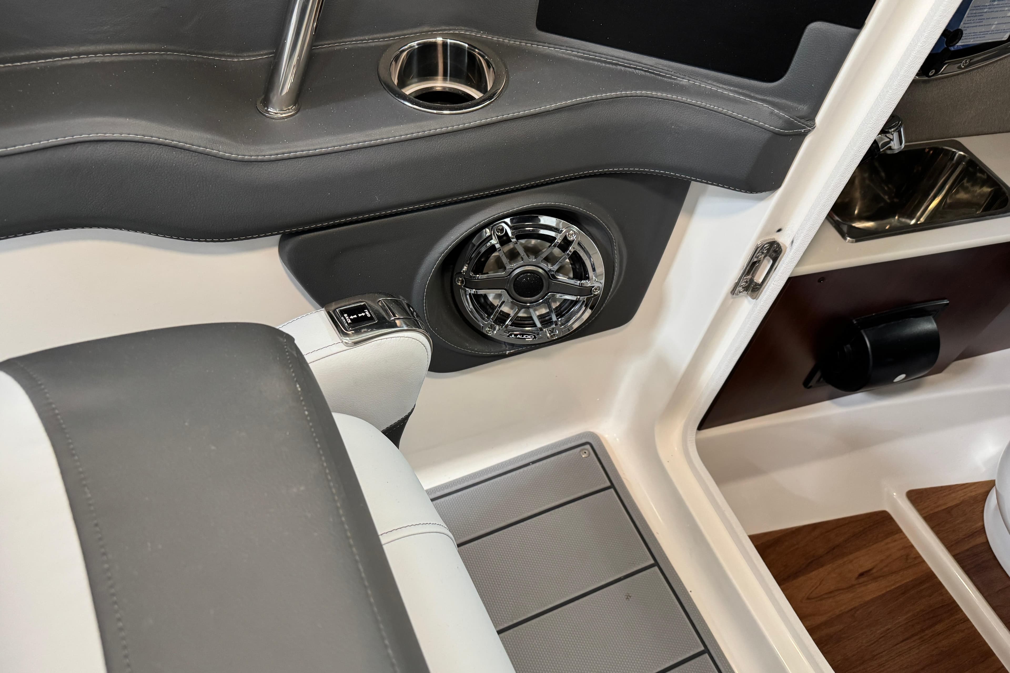Interior of 2026 Chaparral 270 OSX boat featuring speaker and cup holder.
