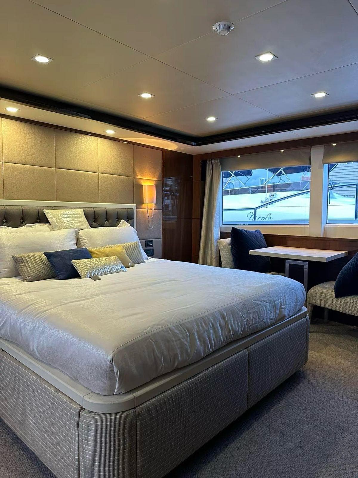Luxurious bedroom interior of 2012 Princess M Class 32M yacht with elegant decor.