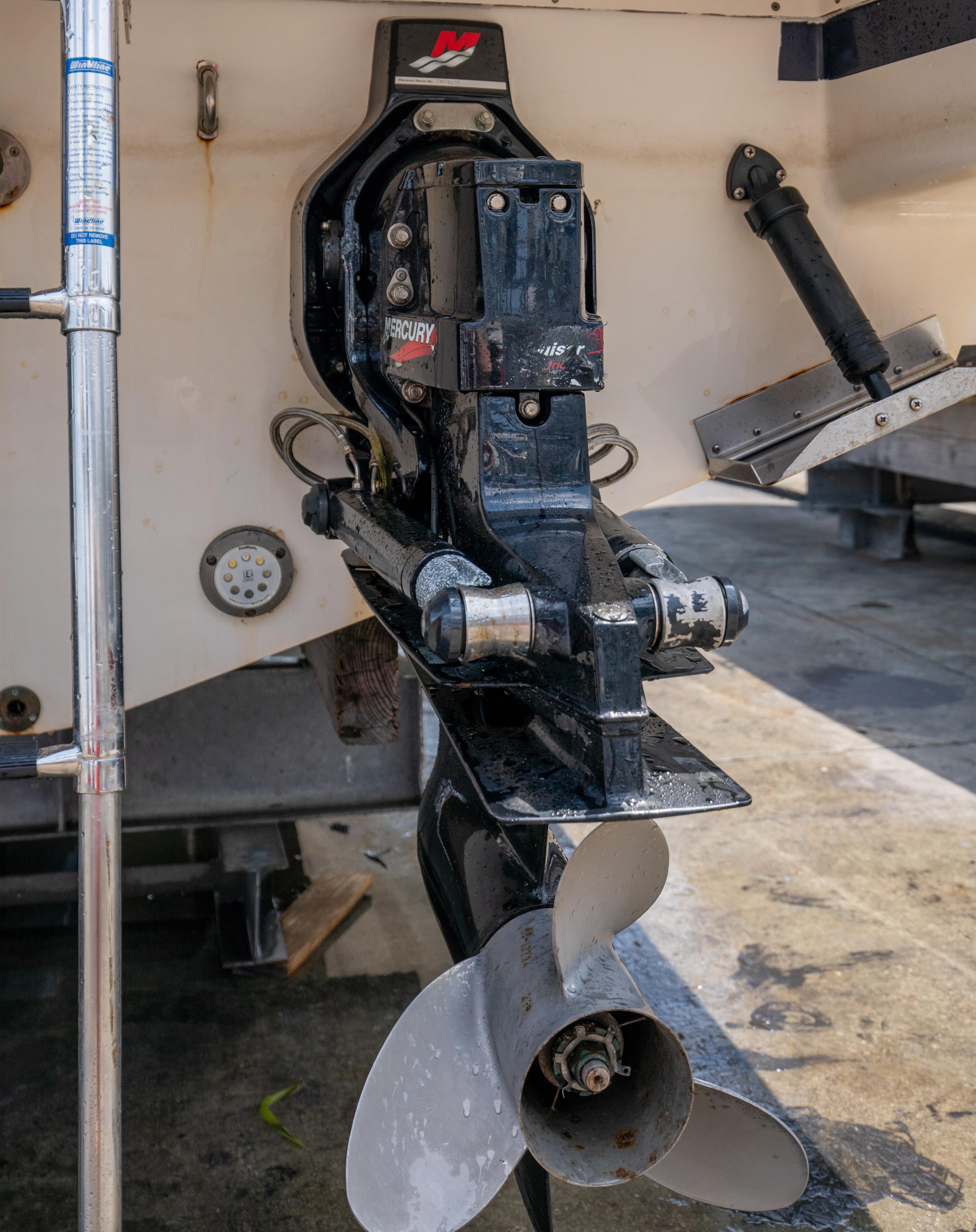 Close-up of a 2004 Chris-Craft Corsair 28 boat's propeller and stern drive.