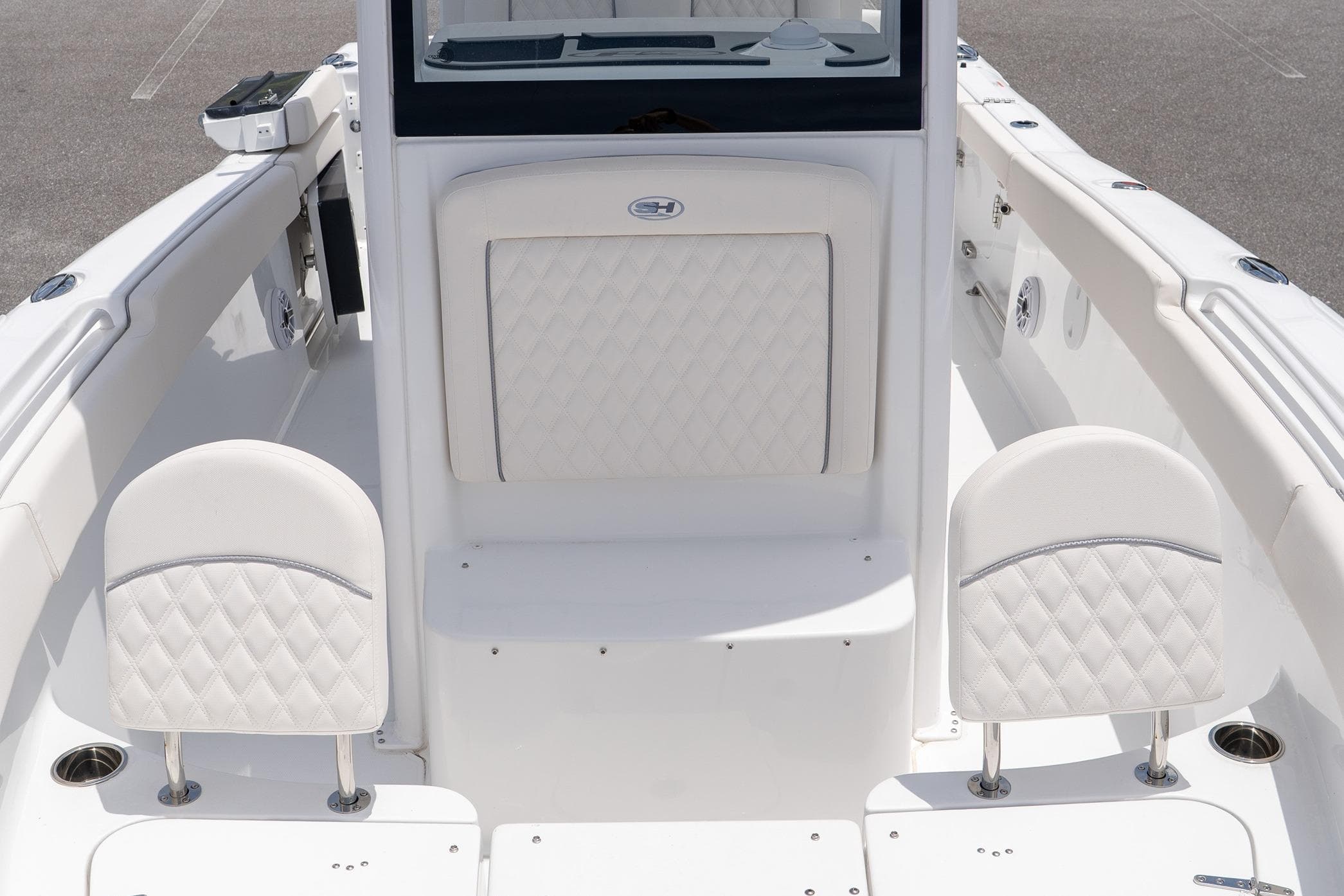 2026 Sea Hunt Ultra 265 SE boat interior with white cushioned seating.
