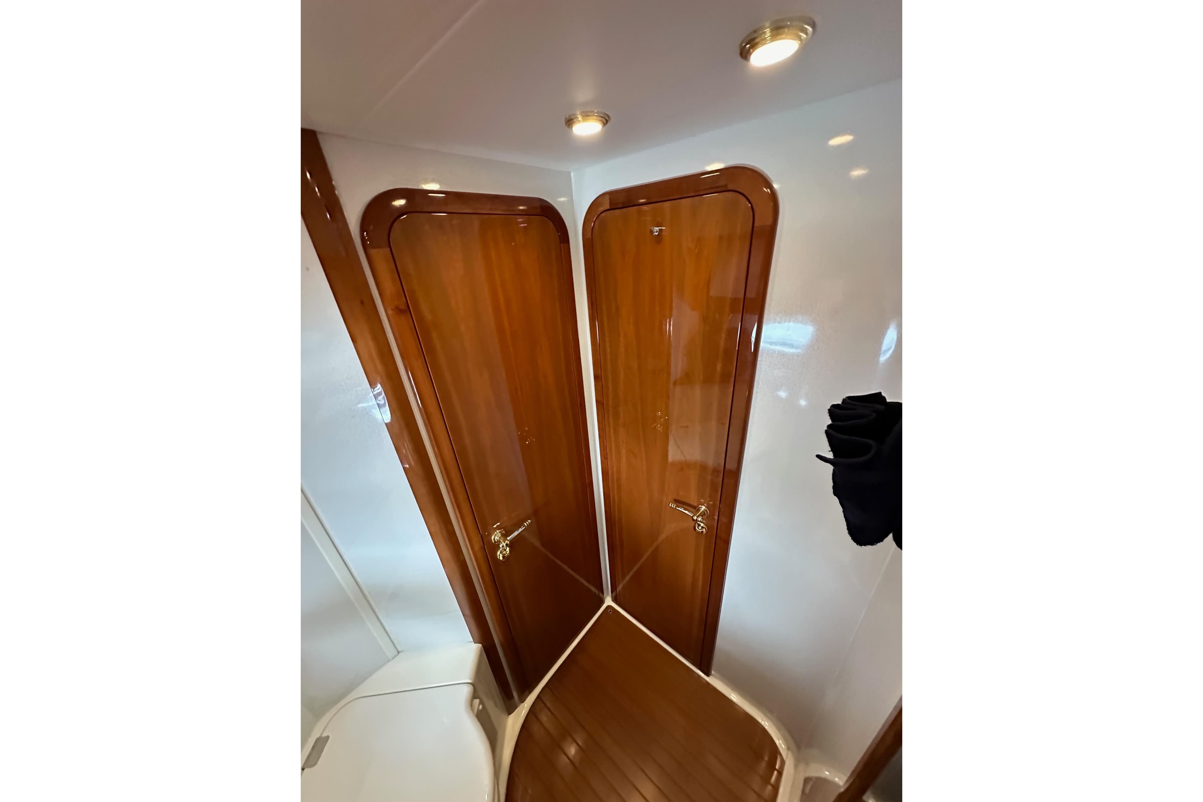 Luxurious wooden interior of 2000 Sunseeker Predator 60 yacht bathroom.