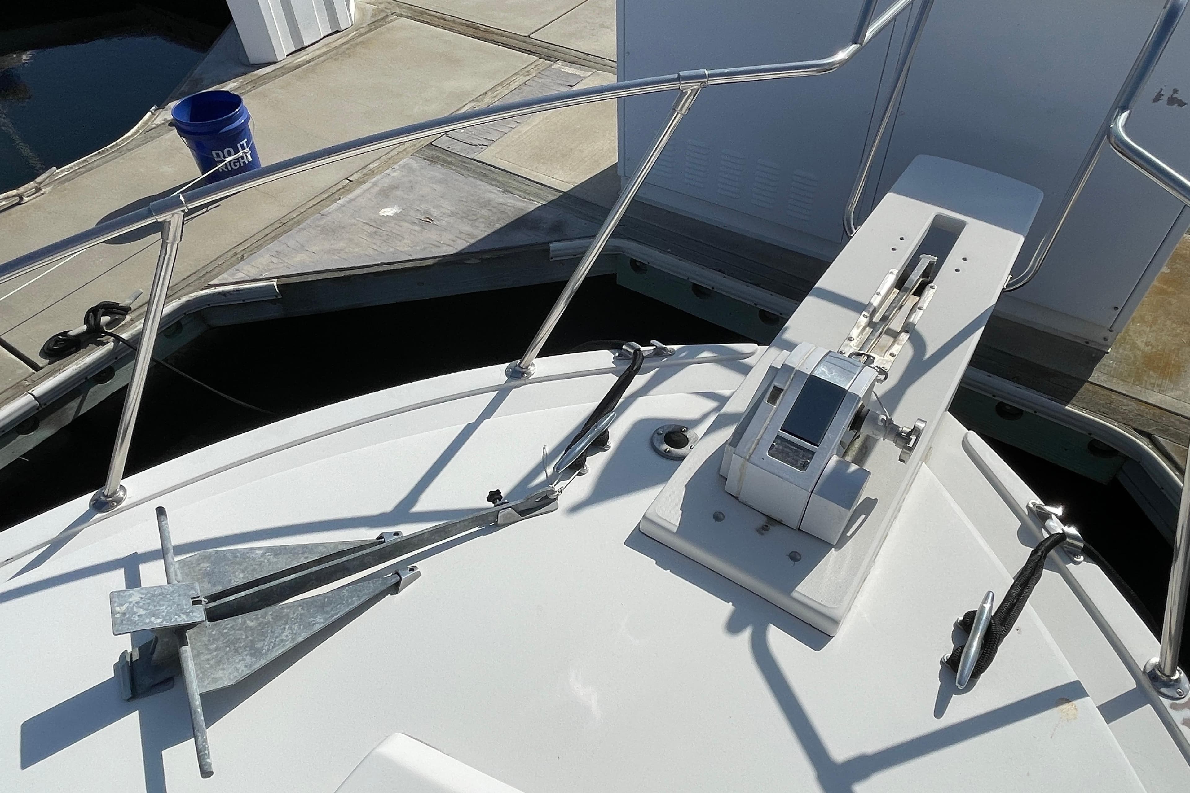 Bow of a 1987 Bertram 28 Flybridge with anchor and winch system.