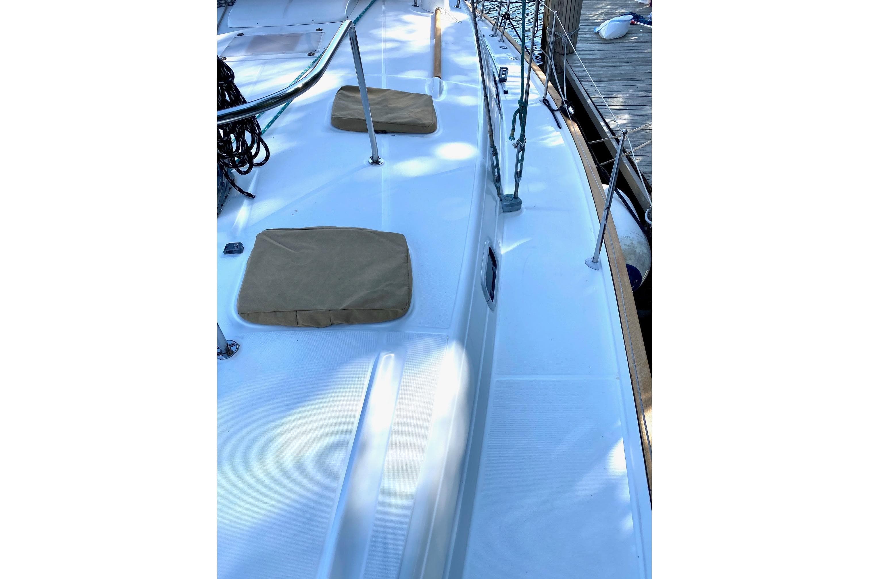 Deck view of a 1997 Beneteau Oceanis 461 sailboat, featuring clean lines and dockside setting.