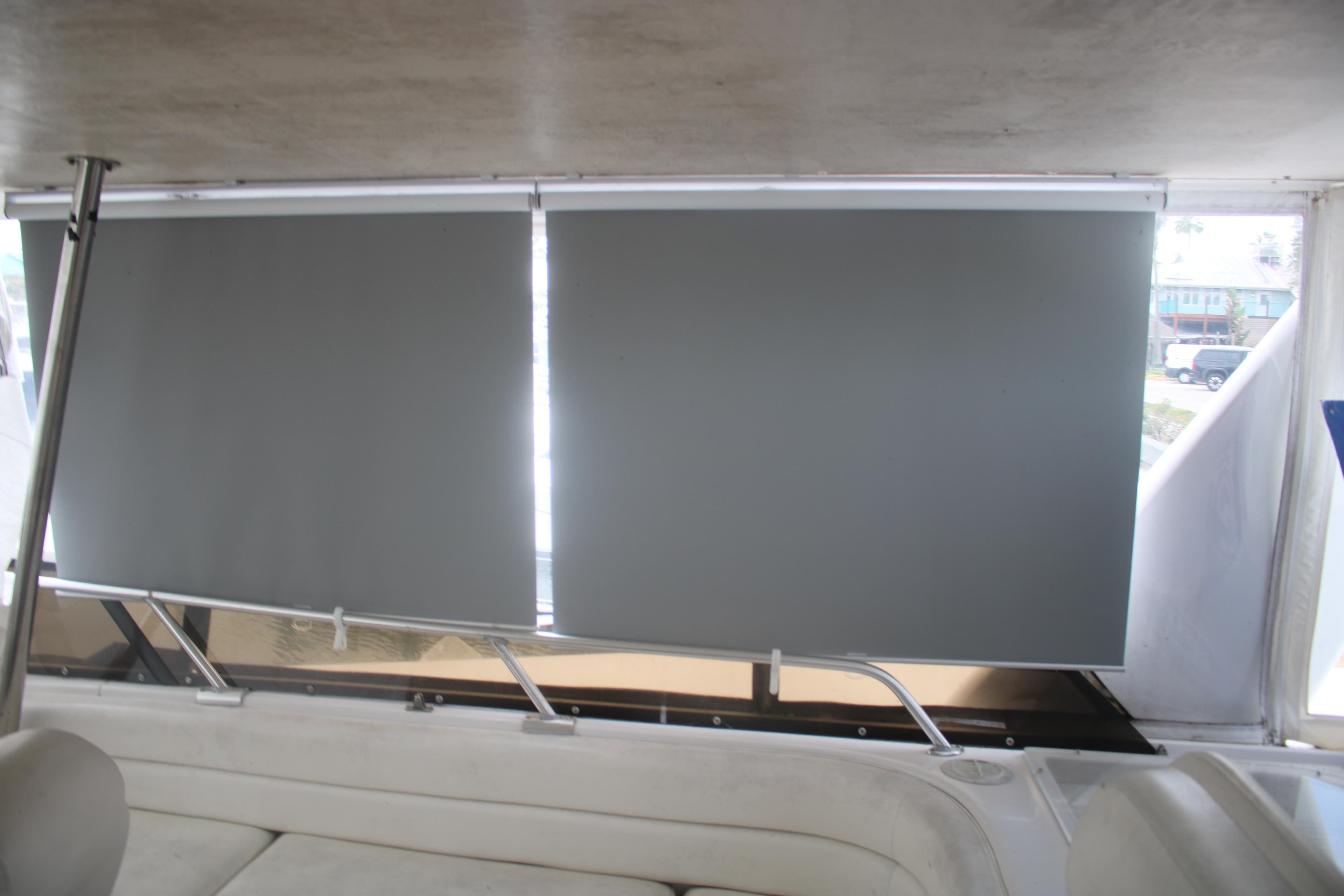 Interior of 1998 Mainship 47 Motor Yacht with closed window blinds.