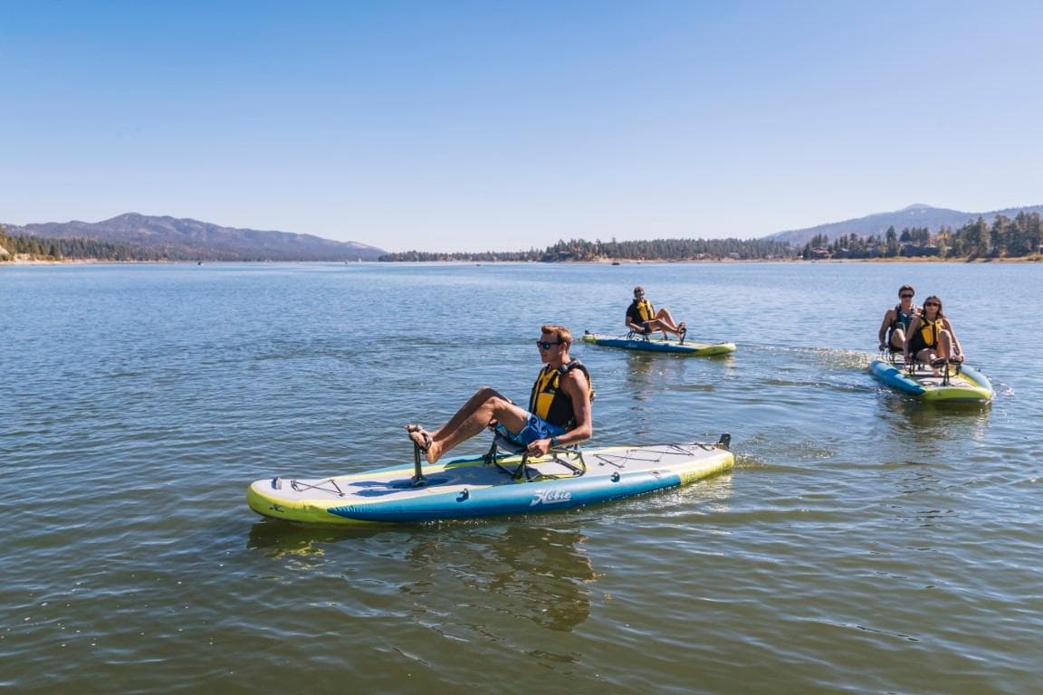 People enjoying a lake on 2023 Hobie ITREK 11 pedalboards.