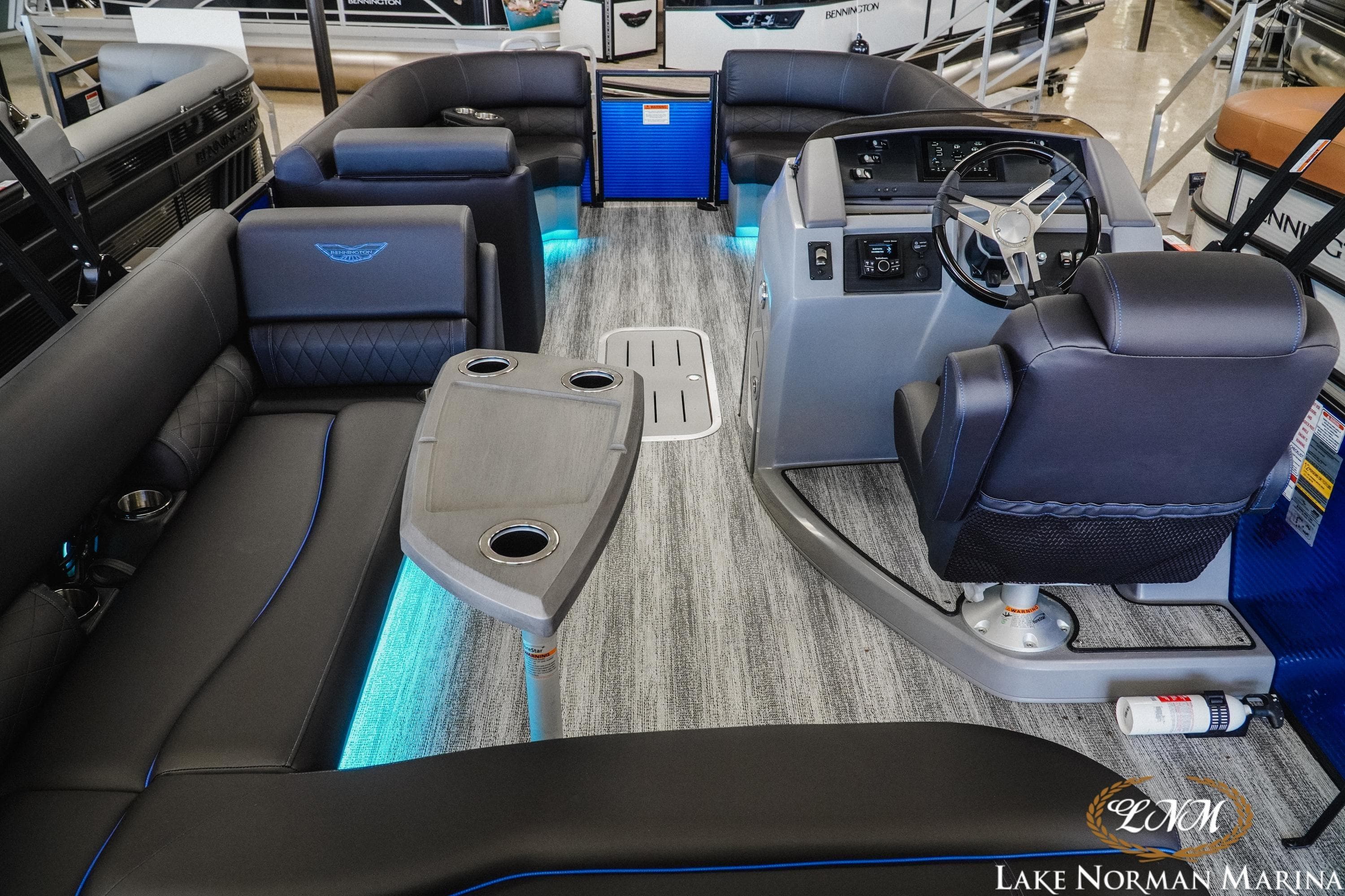 2026 Bennington 23LSB pontoon boat interior with modern seating and steering console.
