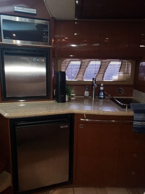 Interior of 2008 Sea Ray 38 Sundancer featuring modern kitchen.