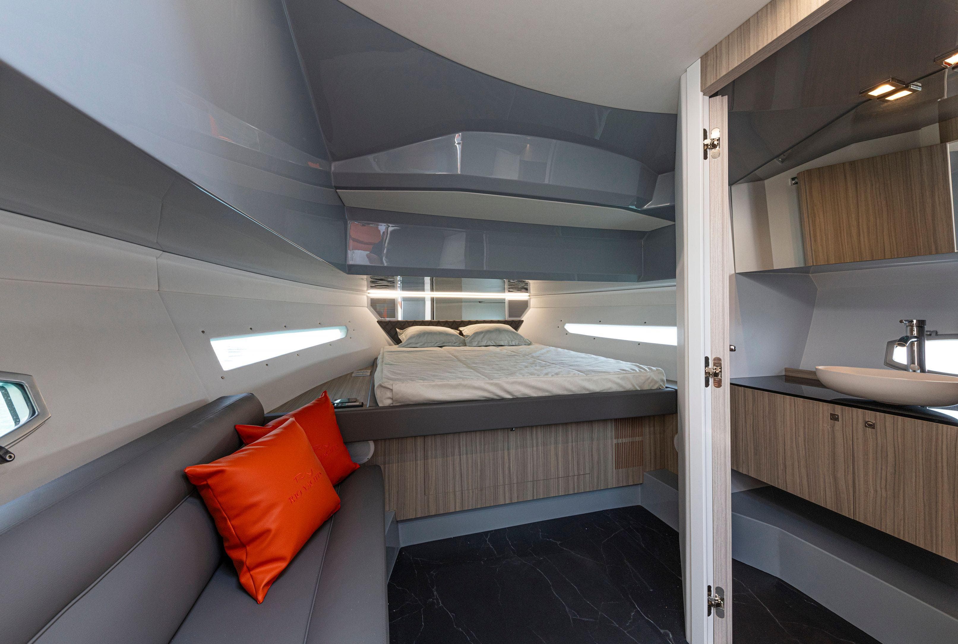 2024 Rio Yachts Daytona 35 interior with modern design, cozy bed, and stylish seating.