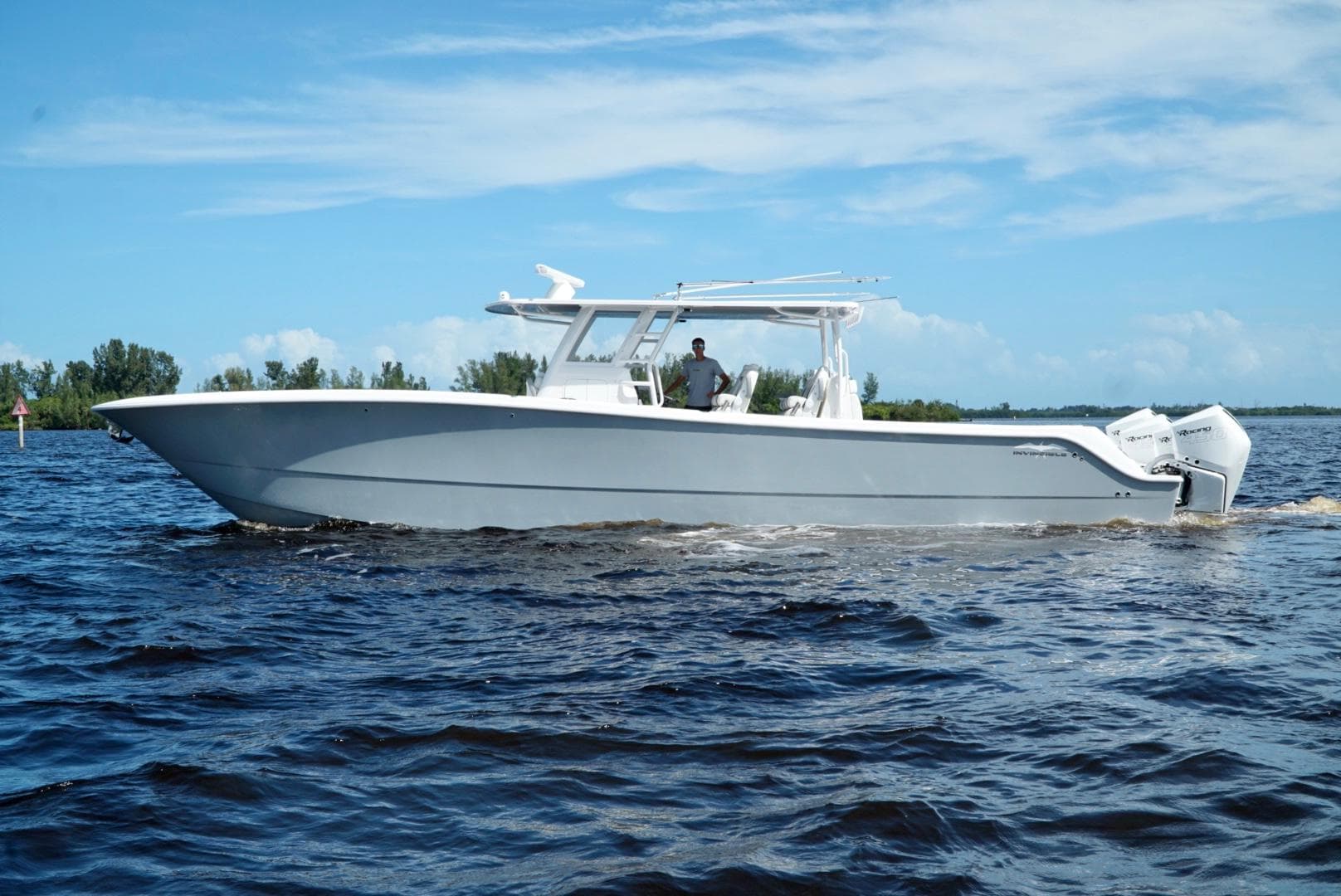 2021 Invincible 46 Catamaran cruising on open water.