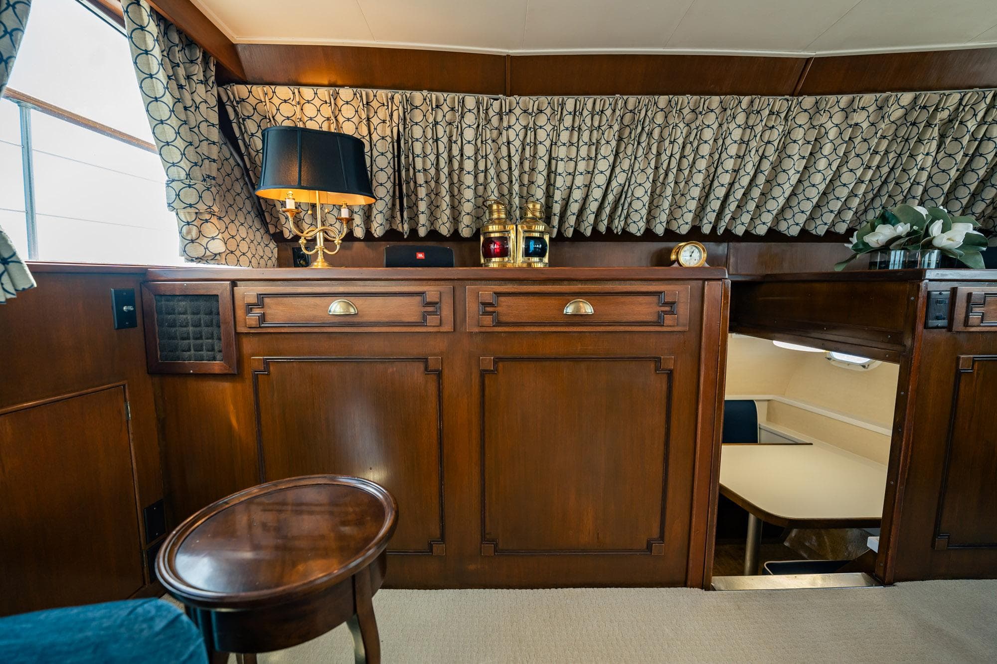 Luxurious interior of a 1964 Burger 64' Motor Yacht with elegant wood paneling.