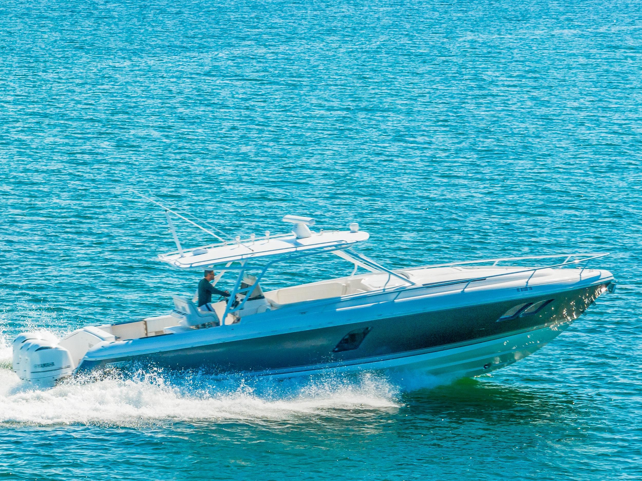 2016 Intrepid 400 Cuddy cruising on clear blue water.