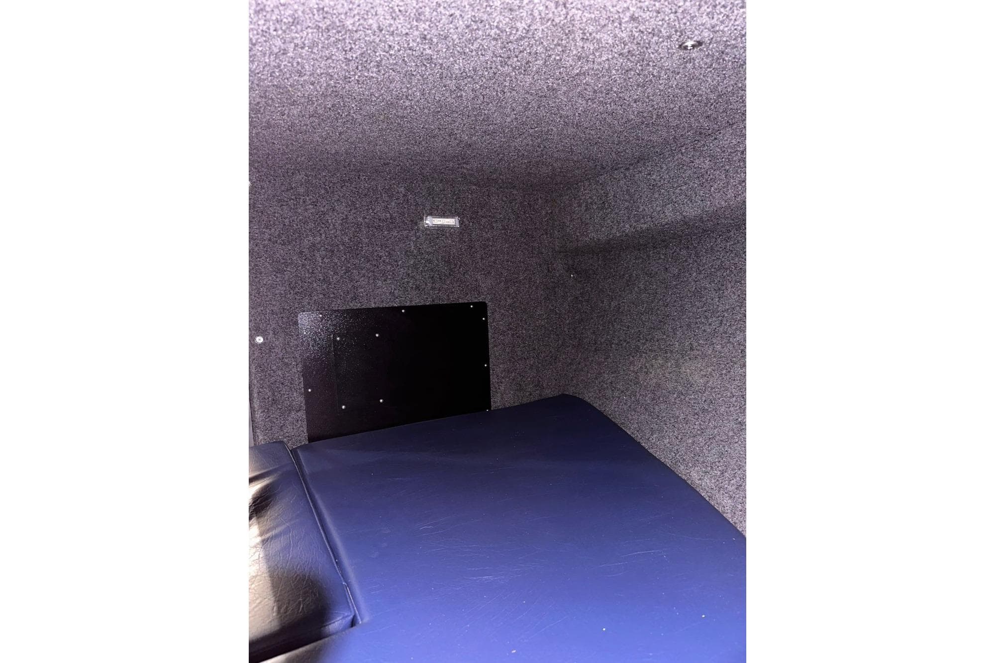 Interior cabin of 2018 Thunder Jet 26 Pilot boat, featuring a cushioned sleeping area.
