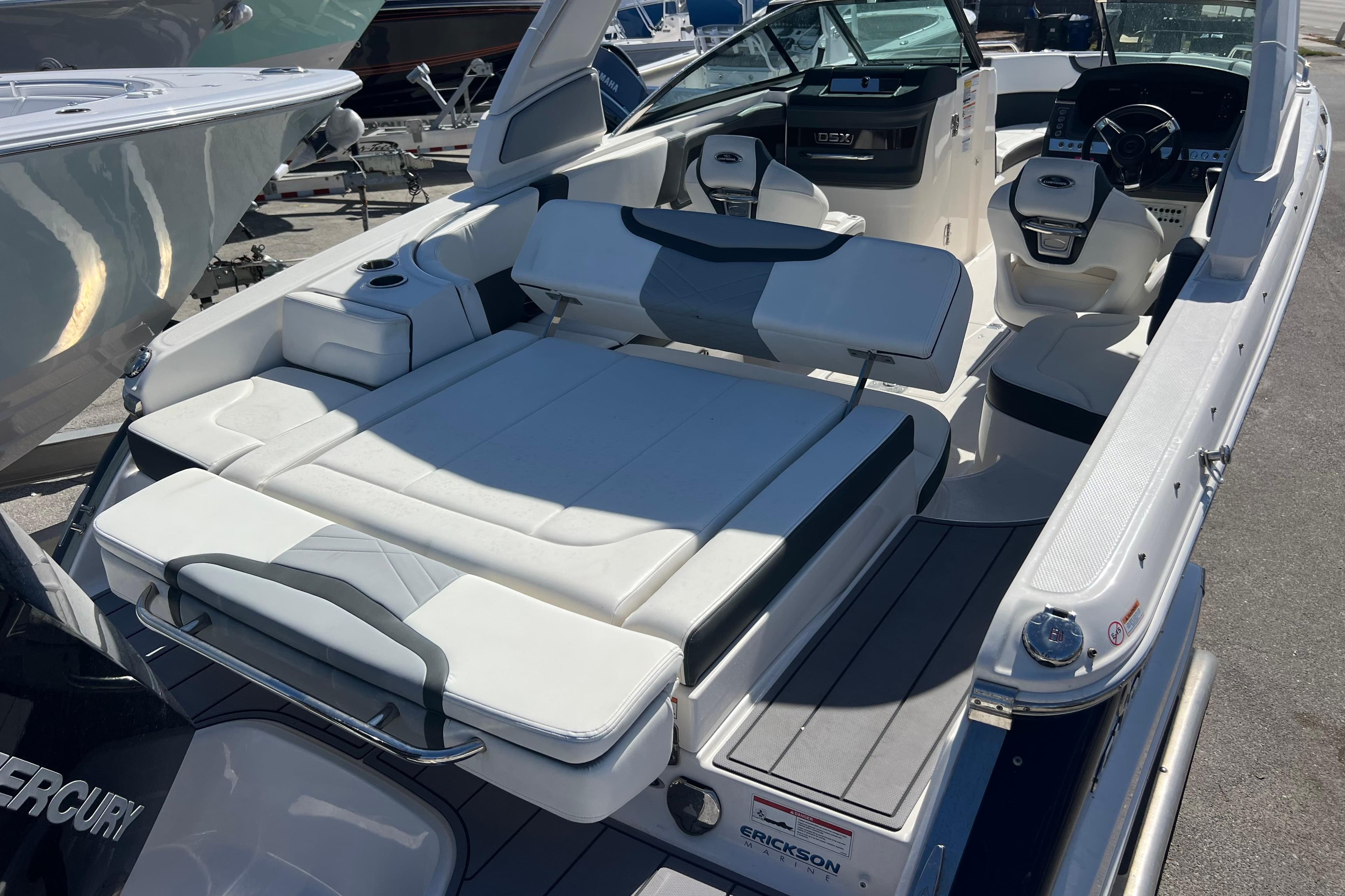 2023 Chaparral 270 OSX boat interior with luxurious seating and modern dashboard.