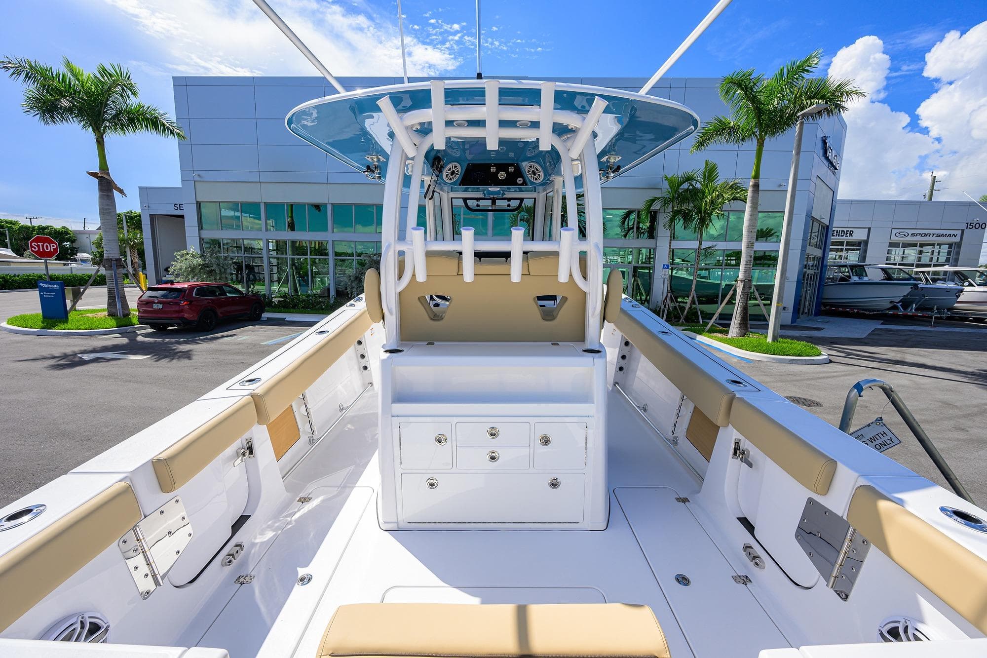 2026 Sportsman Open 302 Center Console boat at dealership, showcasing spacious deck and modern design.