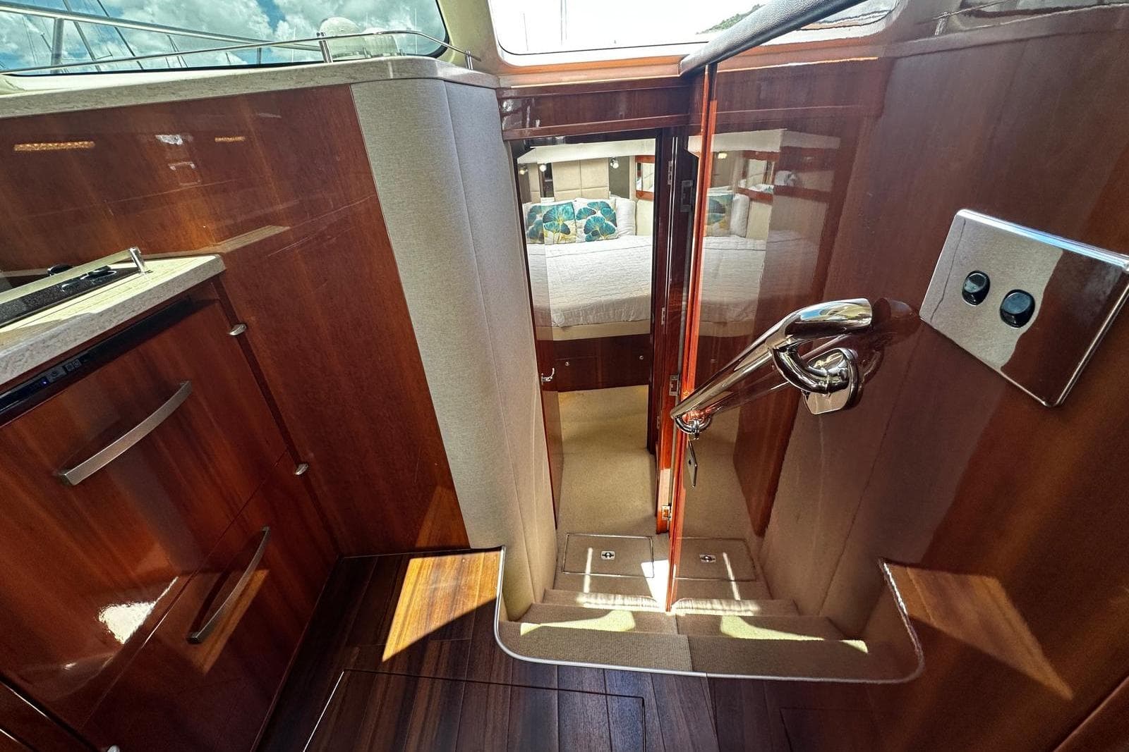 Interior view of 2012 Riviera 43 Flybridge yacht, featuring polished wood and modern design.