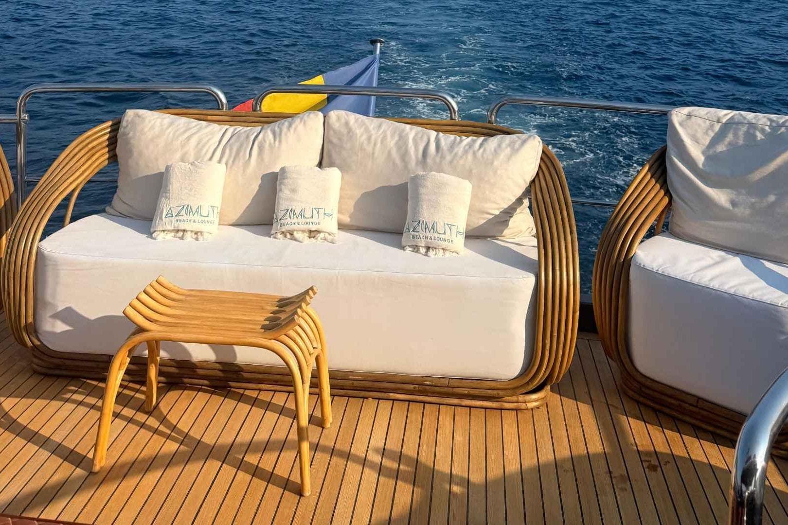 Luxurious Azimut Fly 78 yacht deck with elegant seating, ocean view, and stylish decor.