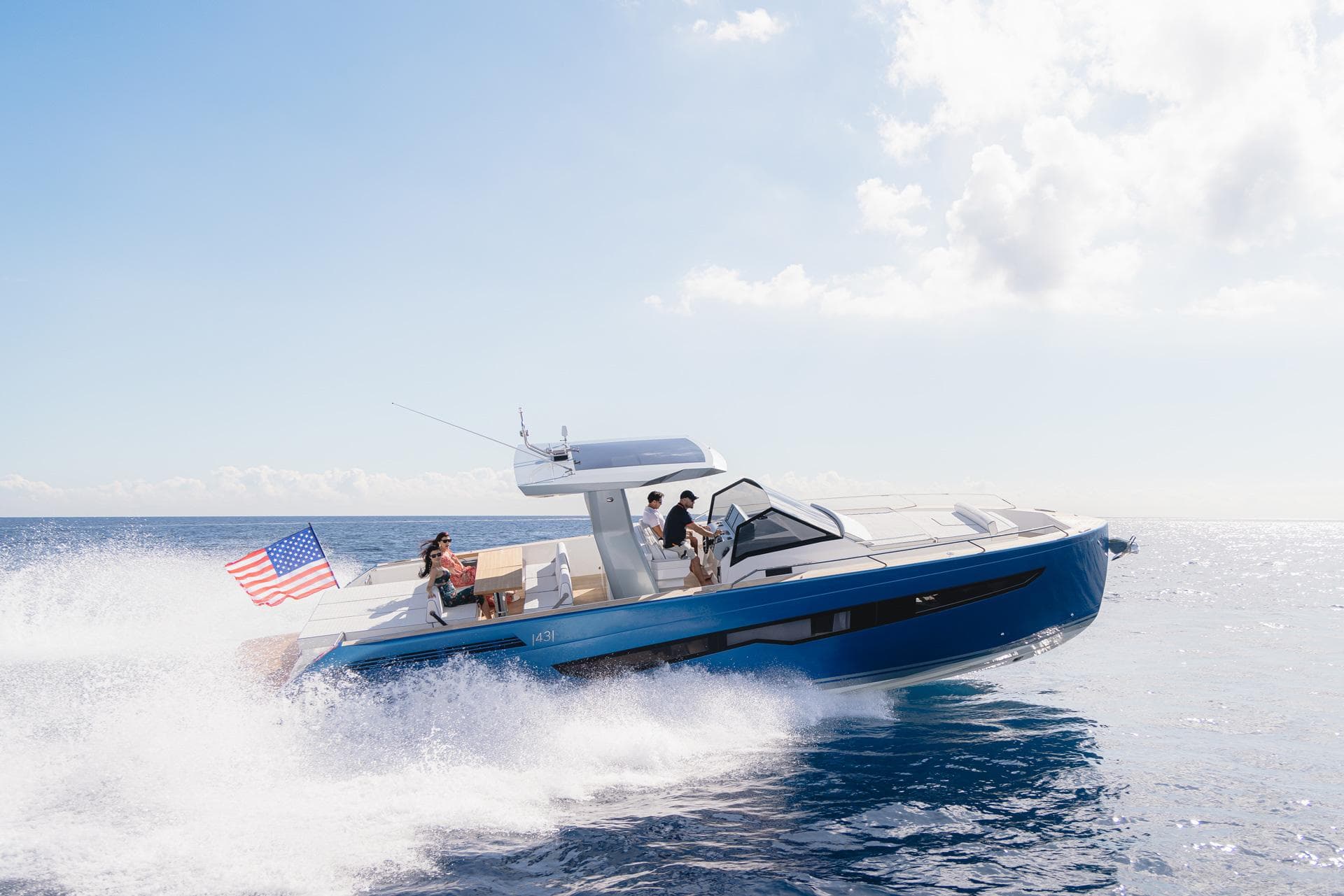 2025 Fiart 43 Seawalker yacht cruising on open water with American flag.