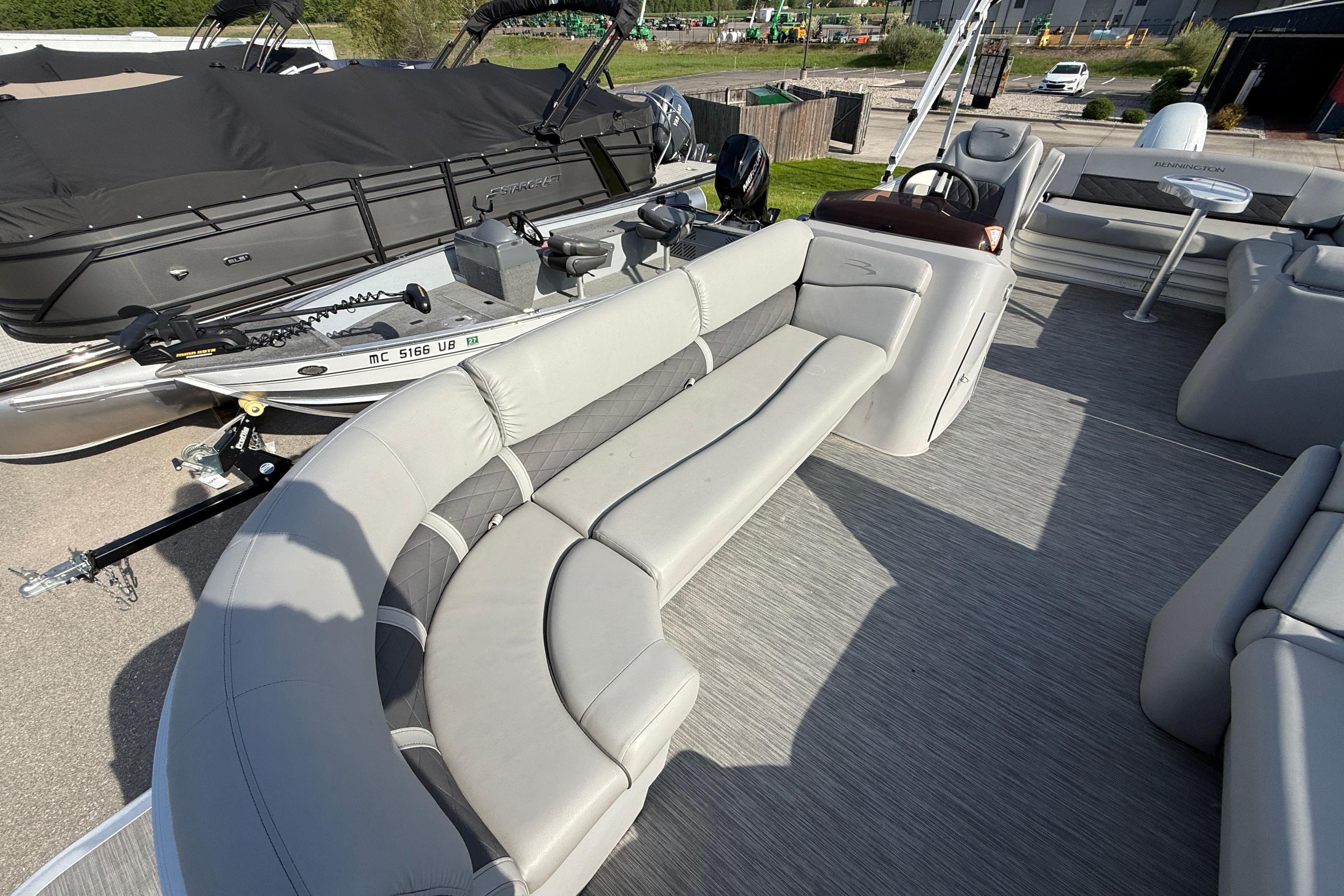 2021 Bennington 25 SSBXSD pontoon boat with spacious seating and modern design.