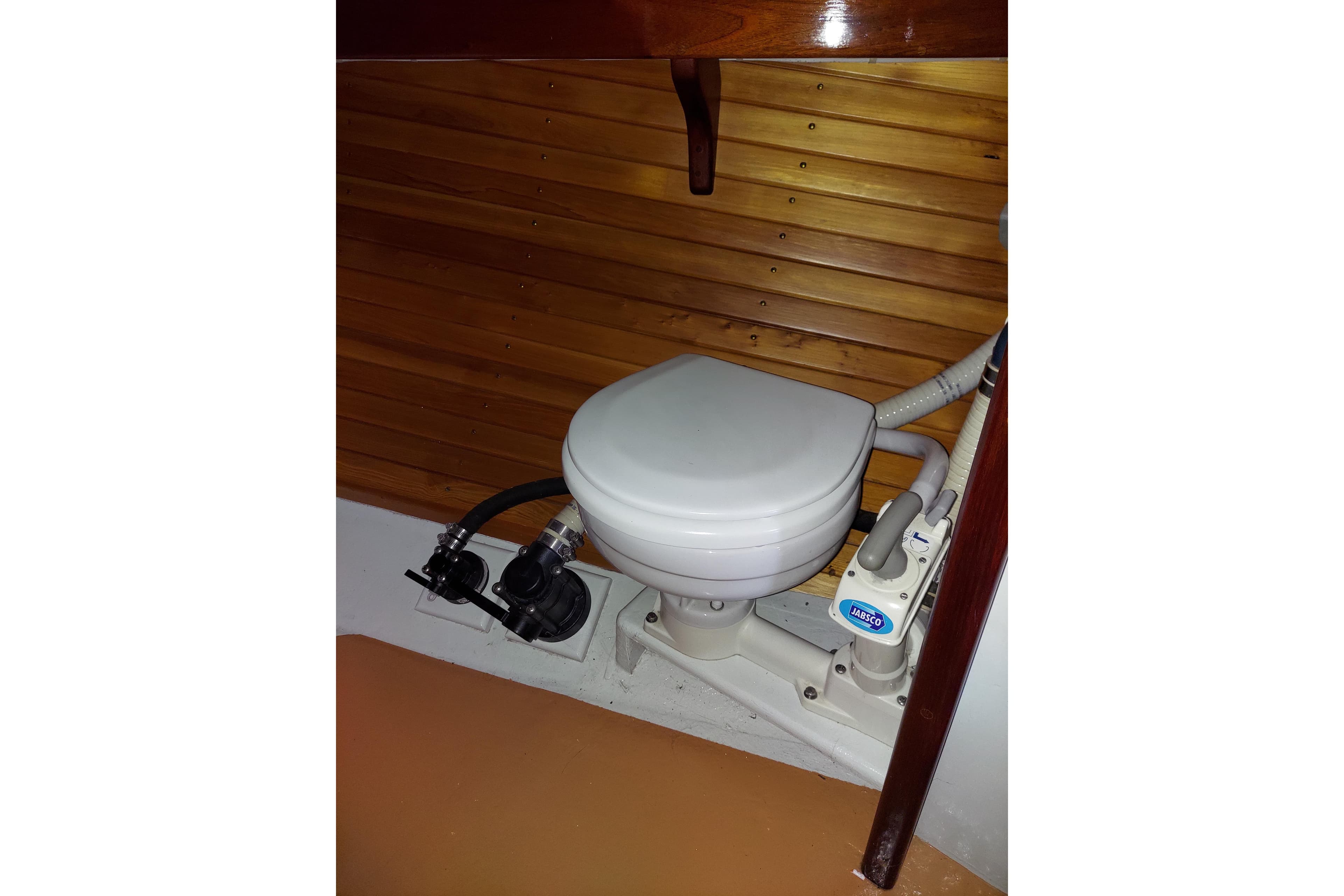 Compact marine toilet in wooden cabin, Marshall 22, 2007 model.