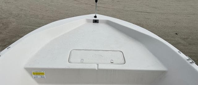 2024 Carolina Skiff EV218 Sea Skiff bow deck with storage compartment.