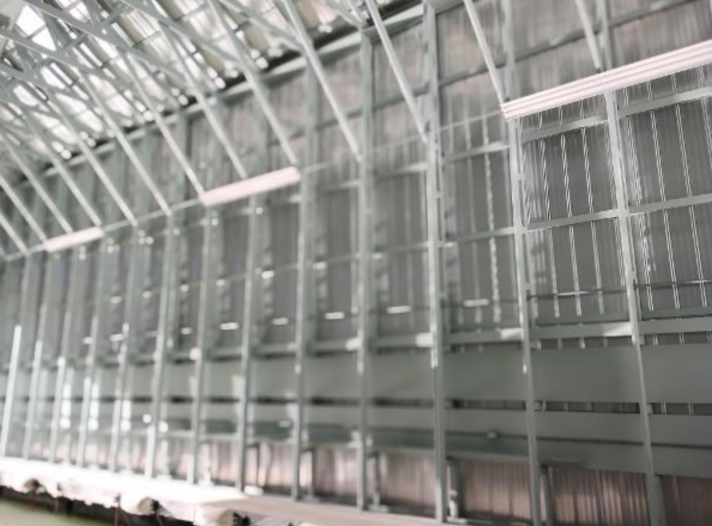 Modern custom boathouse interior with metal framework, 2017 design.