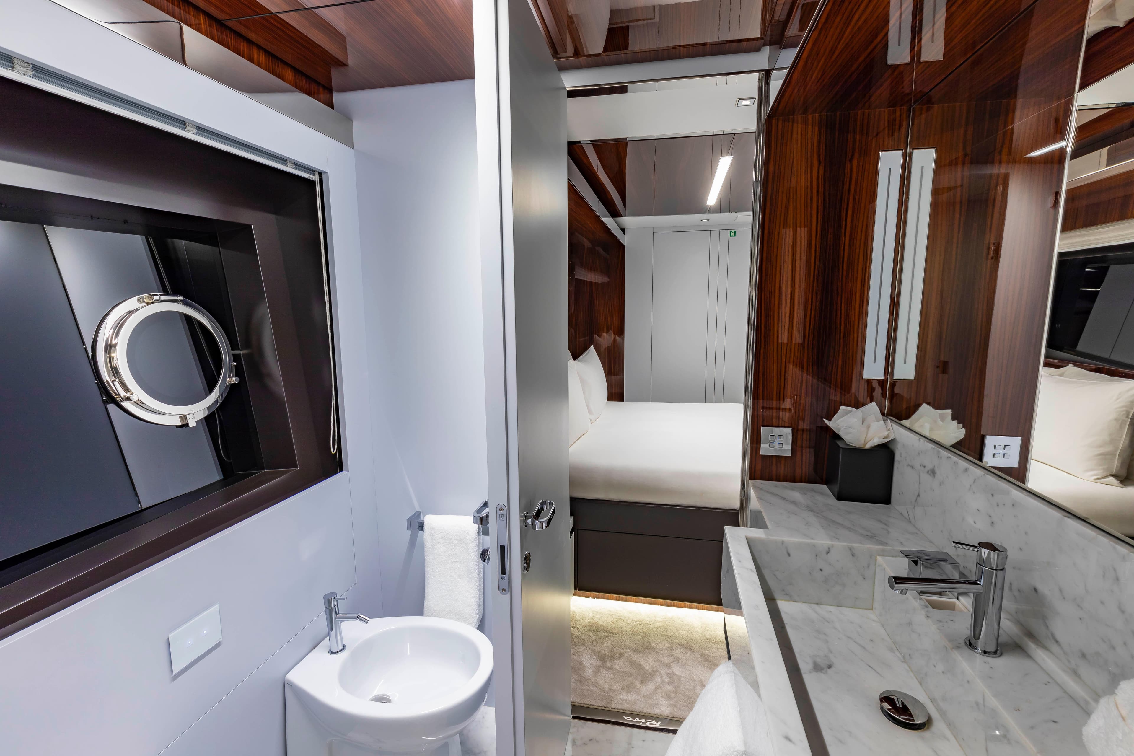 Luxurious bathroom and bedroom interior on 2020 Riva 110' Dolcevita yacht.