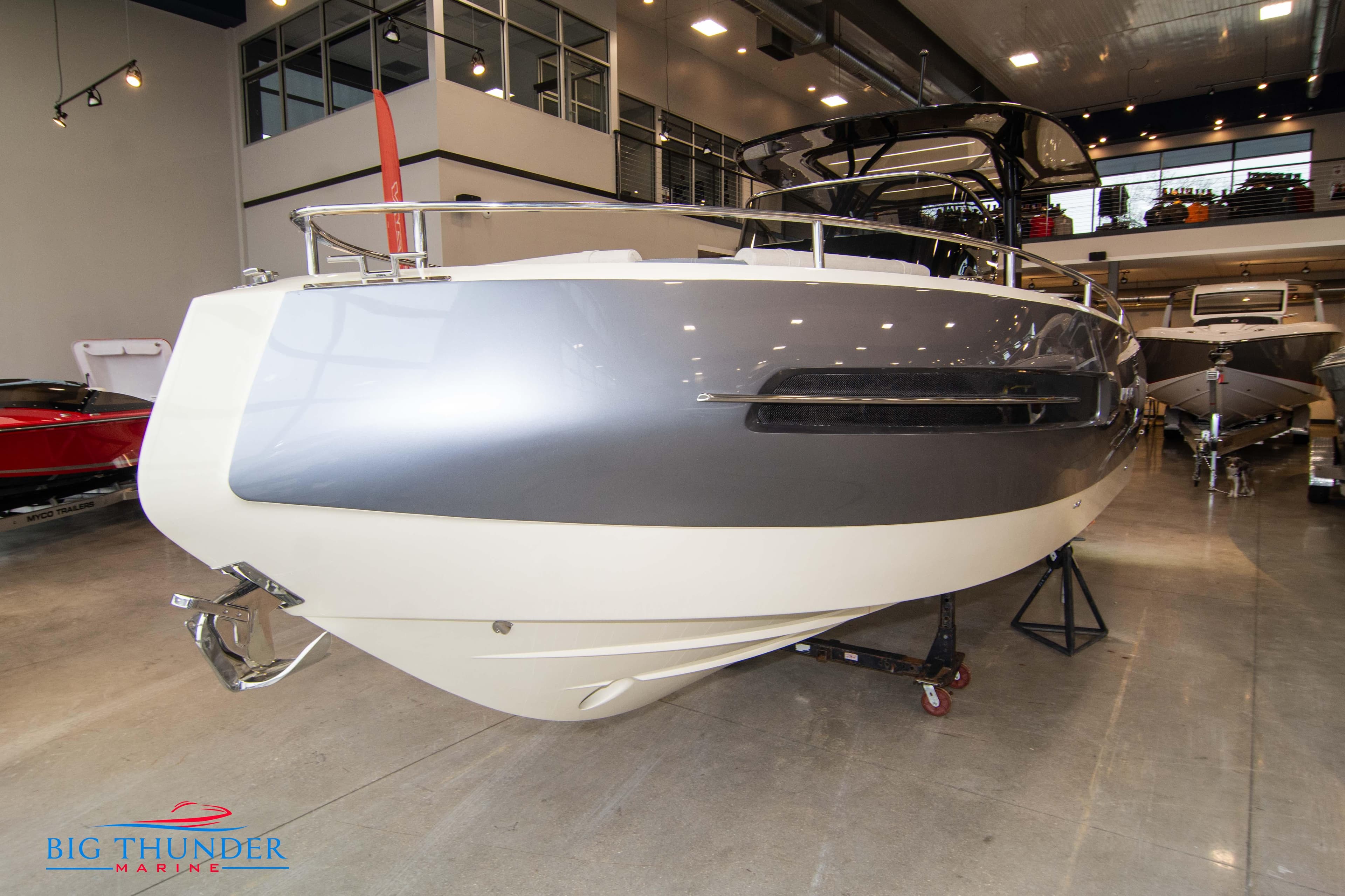 2024 Invictus TT280S luxury boat displayed in a showroom.