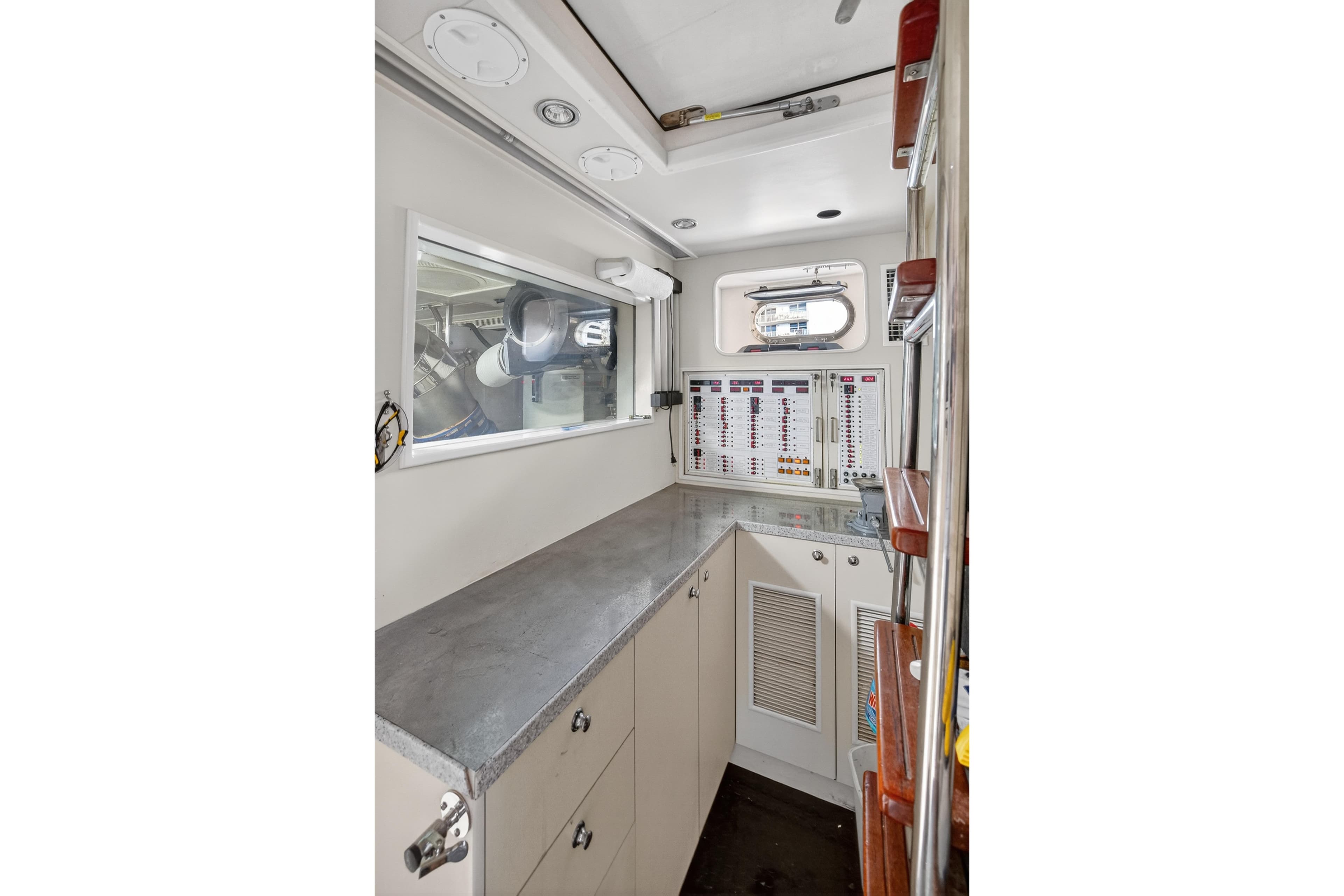 2009 Horizon Flybridge yacht interior with control panels and storage cabinets.