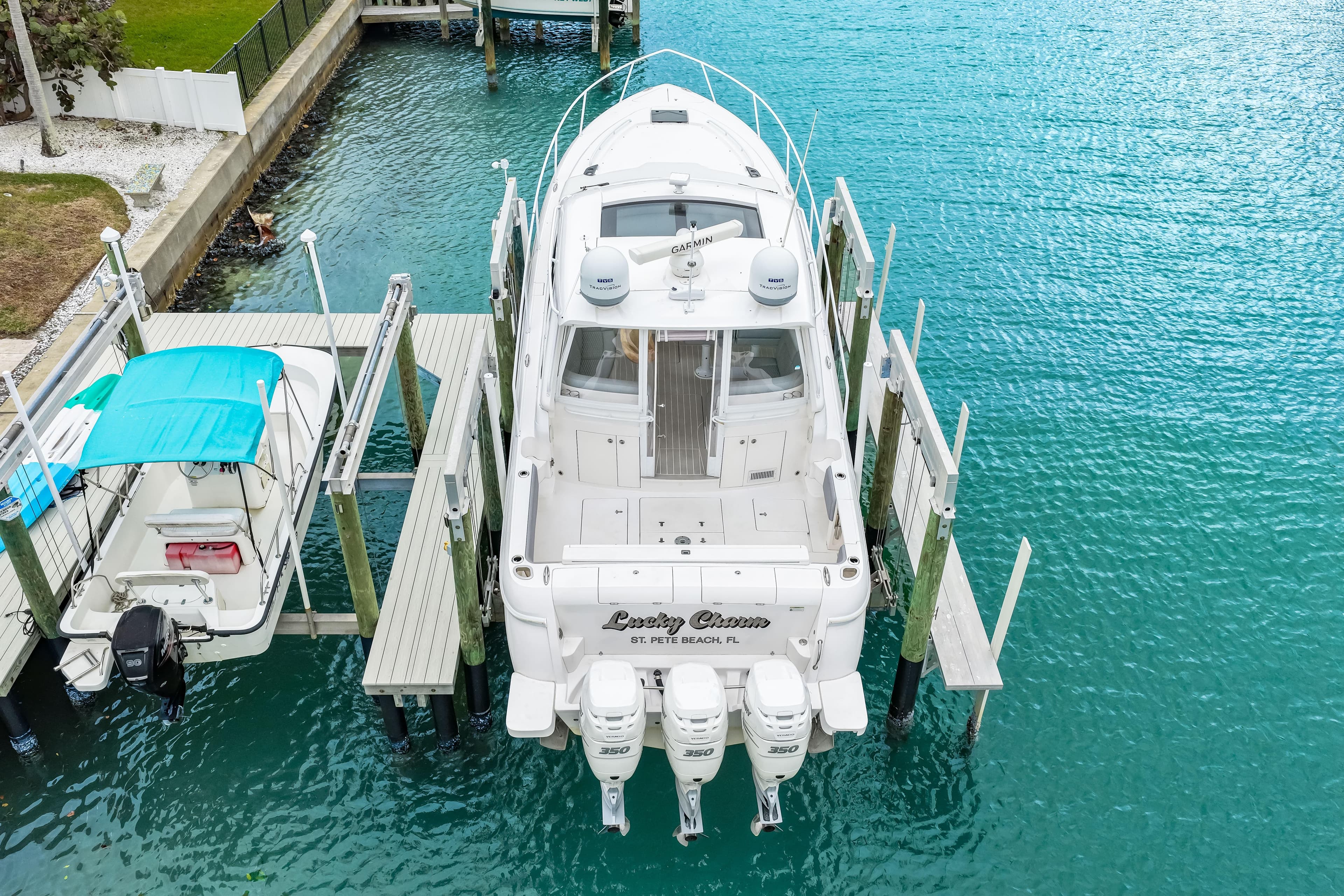 Aerial view of 2019 Intrepid 410 Evolution yacht docked in turquoise water.