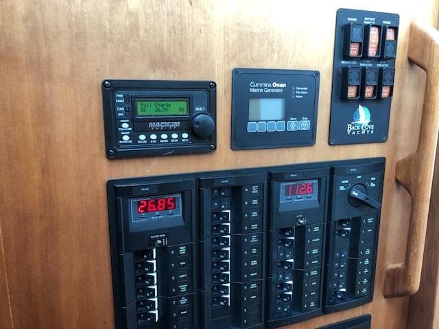 Control panel of a 2014 Back Cove 41 yacht with marine generator and circuit breakers.
