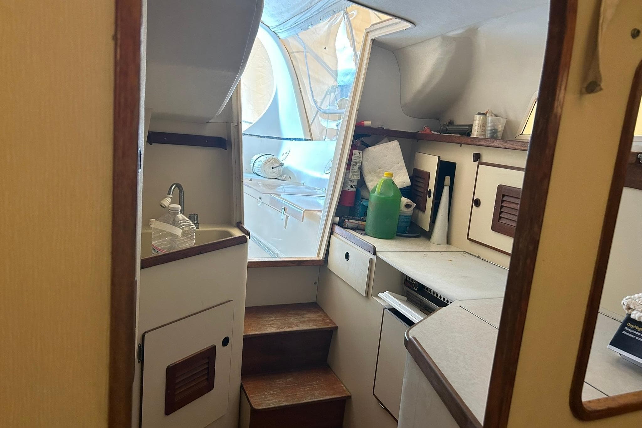Interior of a 1991 Tillotson-Pearson Manta sailboat, featuring a compact kitchen area.