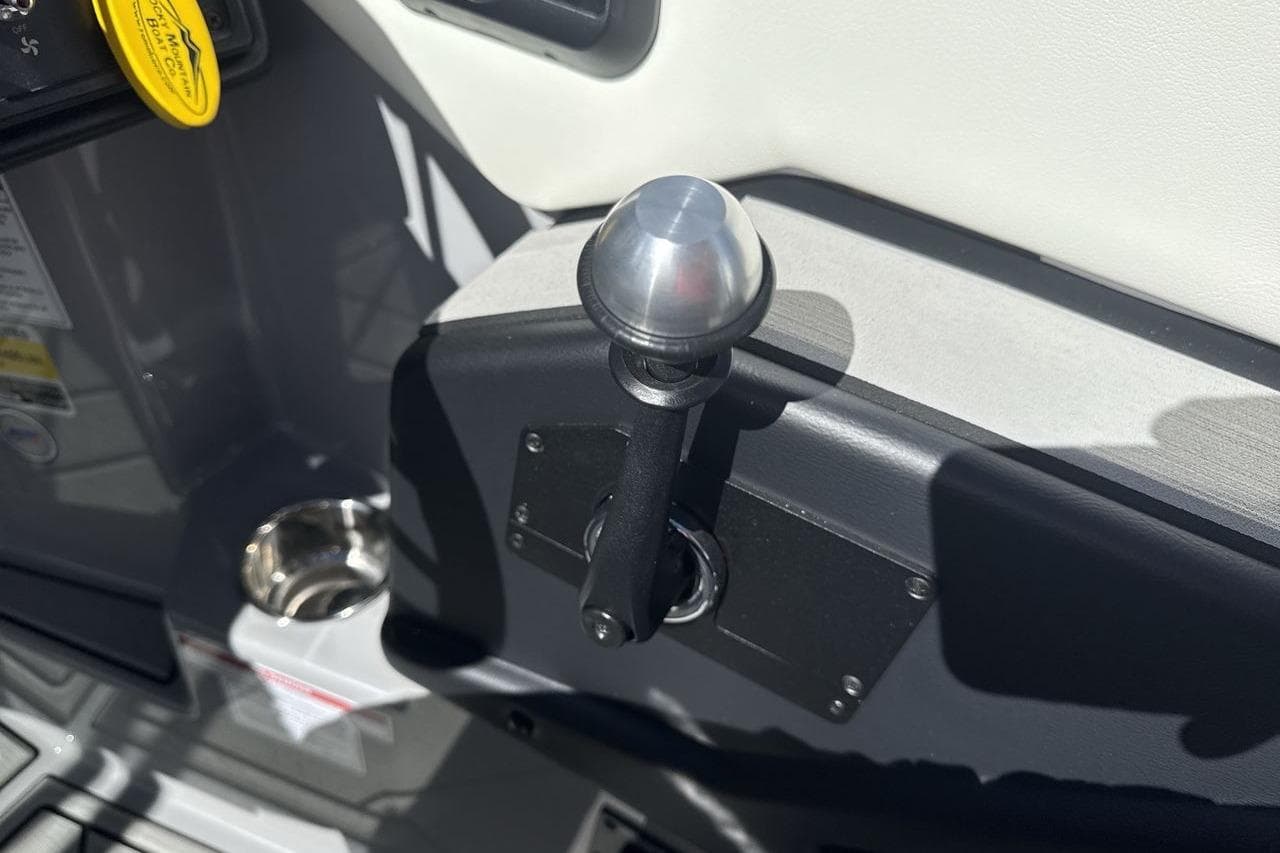 2025 Moomba Craz boat throttle control lever with metallic knob and cup holder.