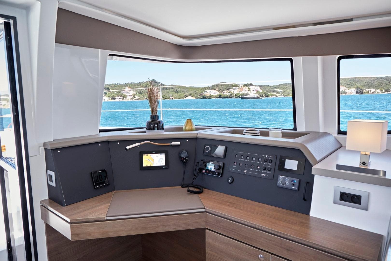 Helm station of 2025 Bali 4.4 yacht with ocean view and modern controls.