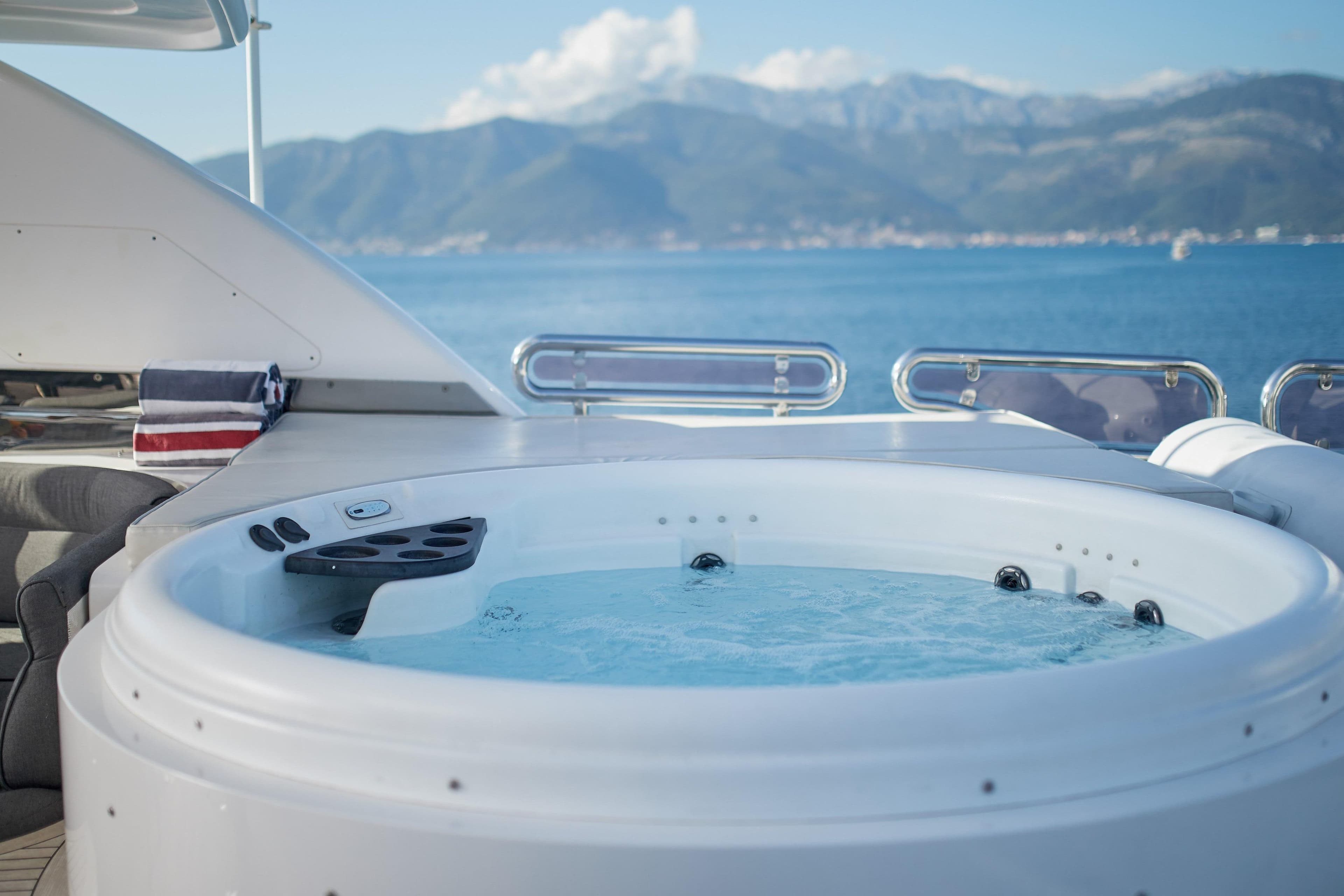 Luxurious yacht hot tub with ocean and mountain views, Horizon 97, 2009 model.