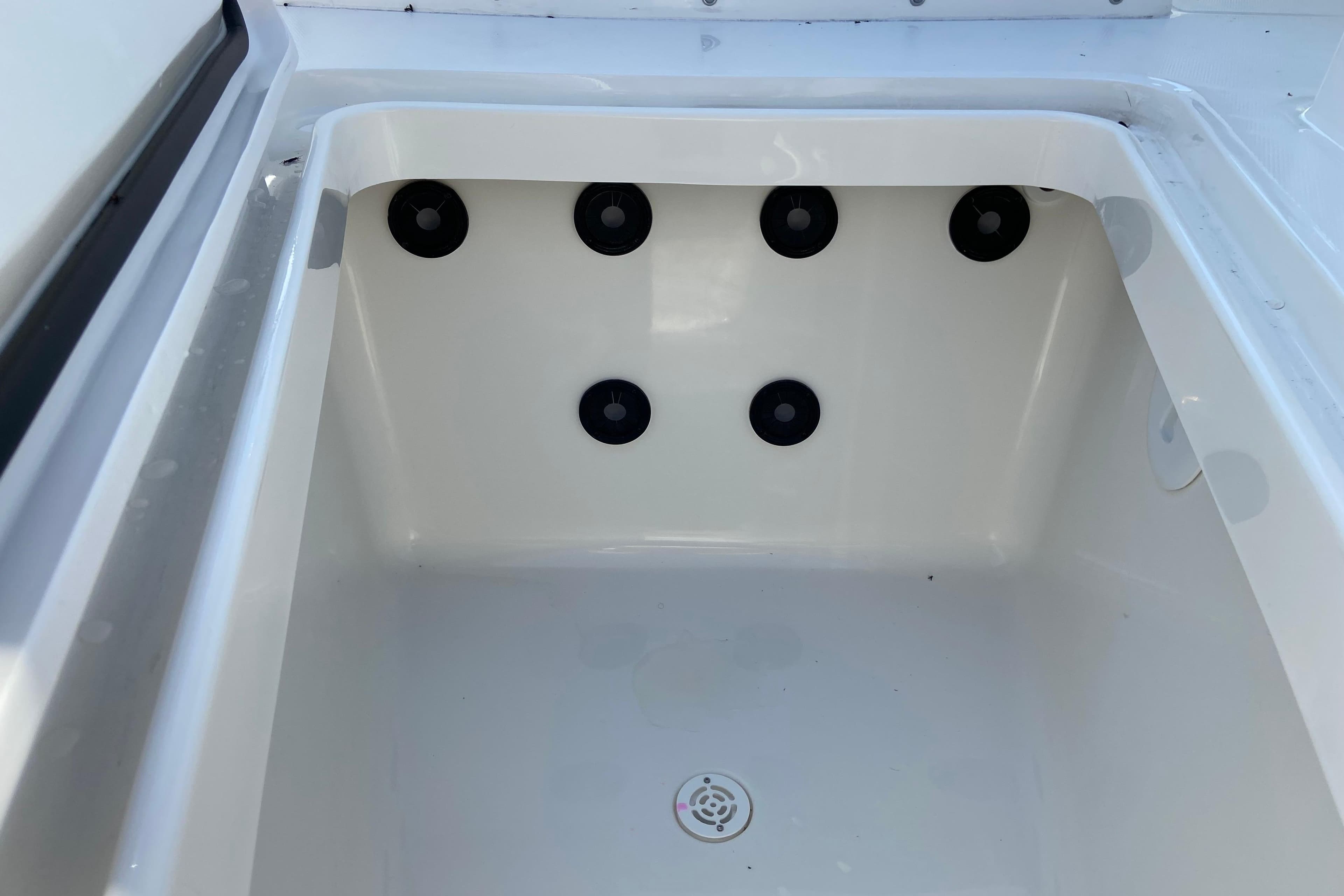 2026 Regulator 31 boat storage compartment with drainage holes.