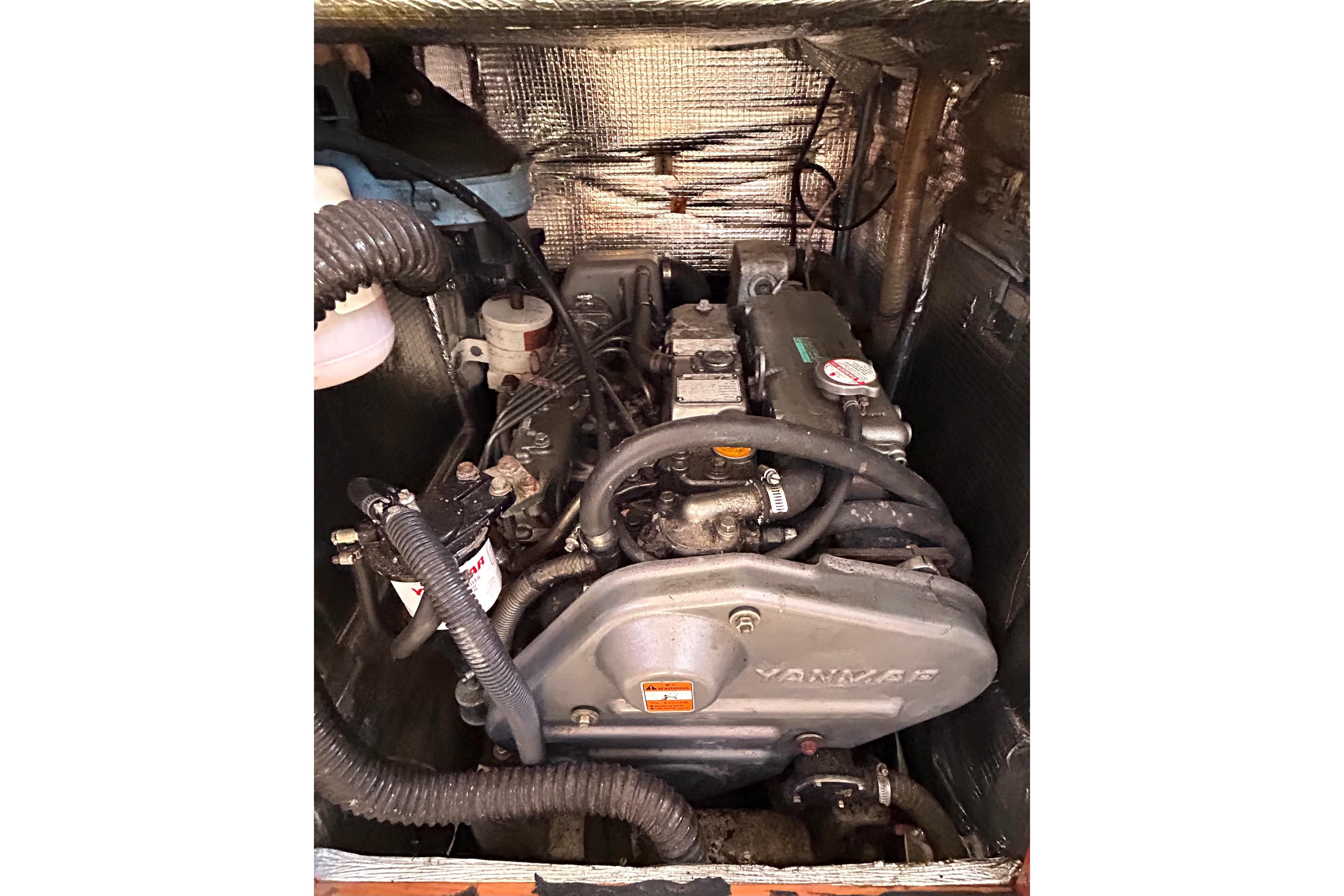 Engine compartment of a 2008 Hanse 470e sailboat, featuring a Yanmar engine.