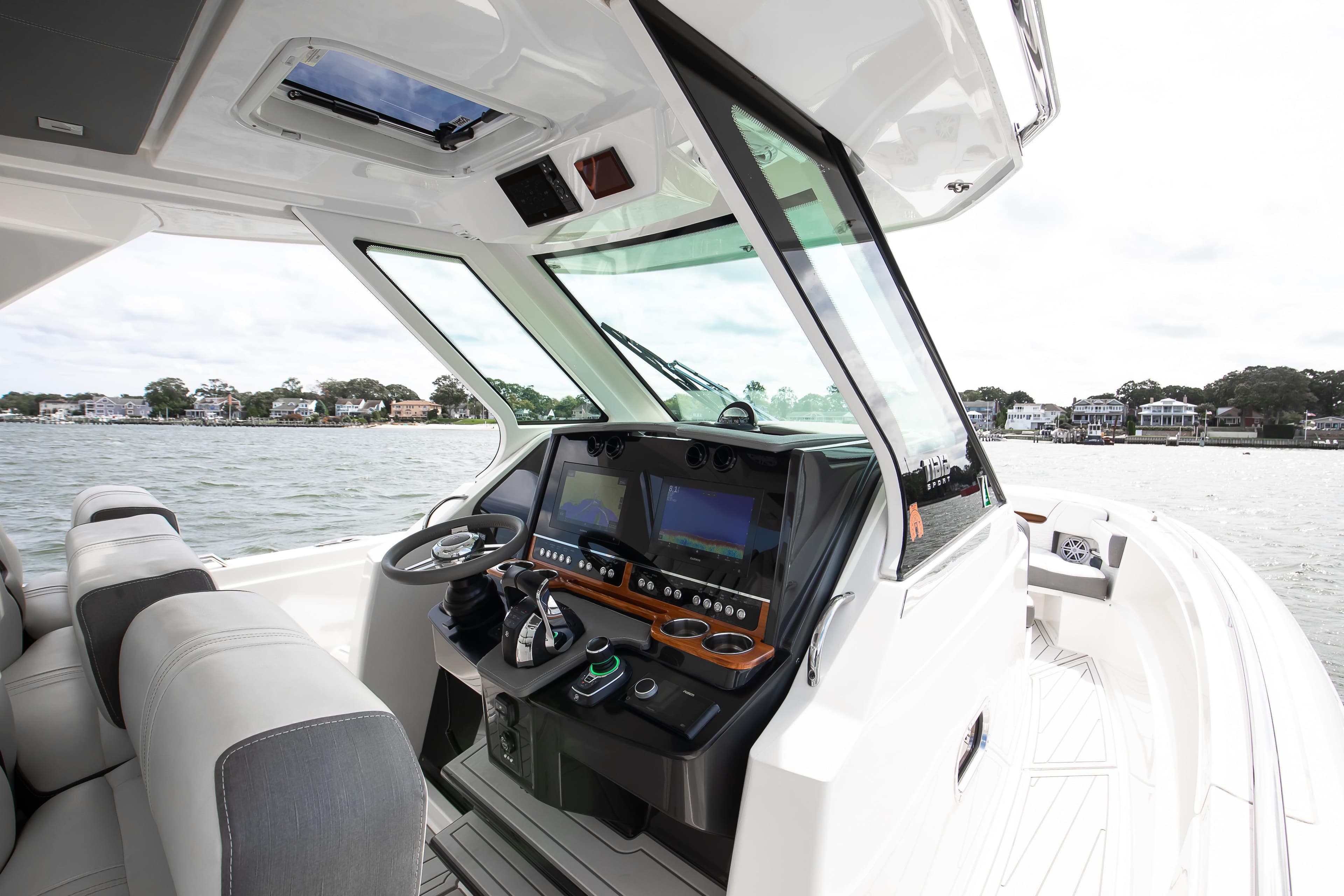 2020 Tiara Sport 34 LS boat interior with modern dashboard and steering wheel.