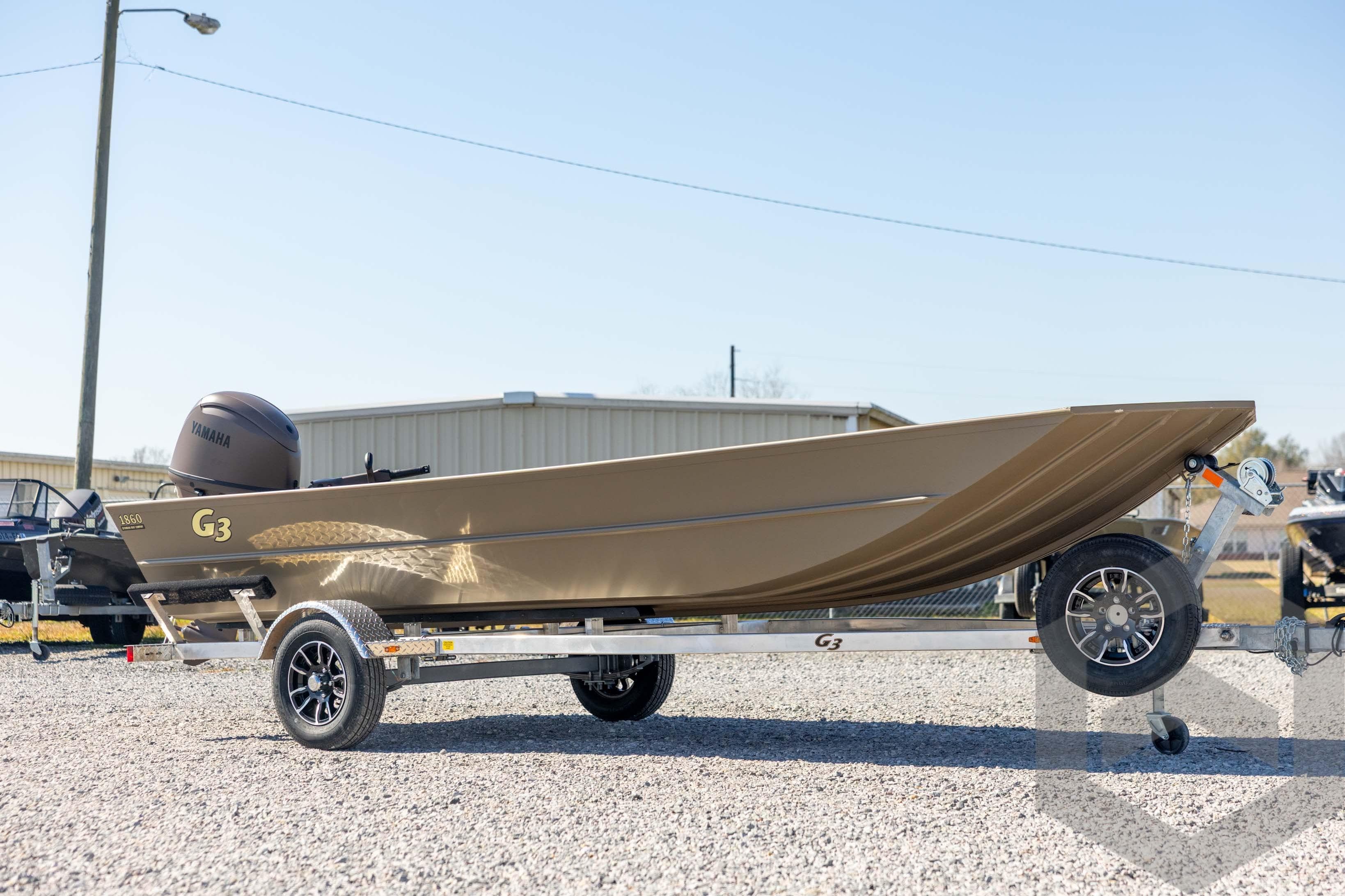 2026 G3 Gator Tough 1860 VBW boat on trailer, outdoor display.