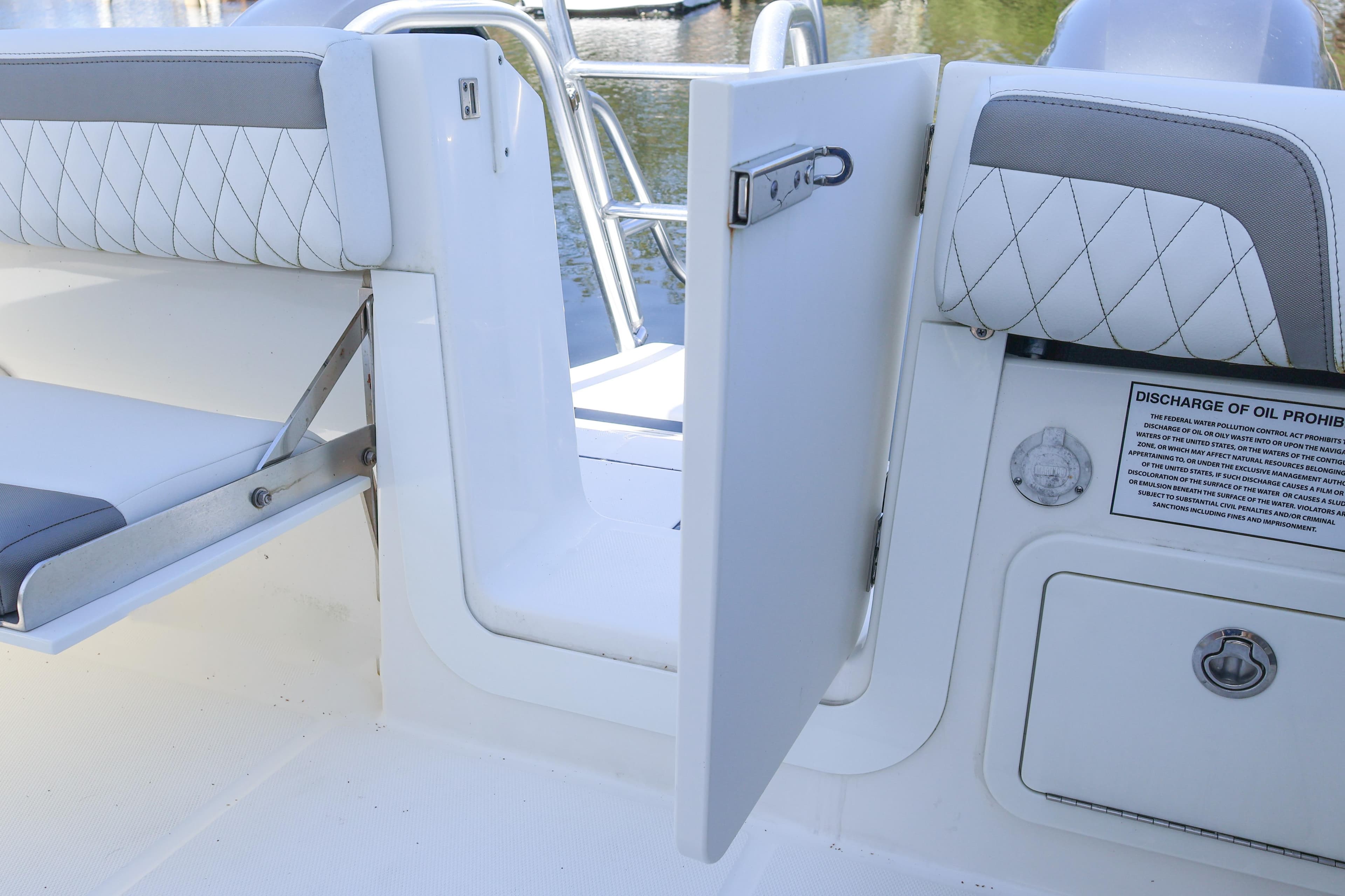 2022 World Cat 280 CC-X boat interior with open door and seating area.