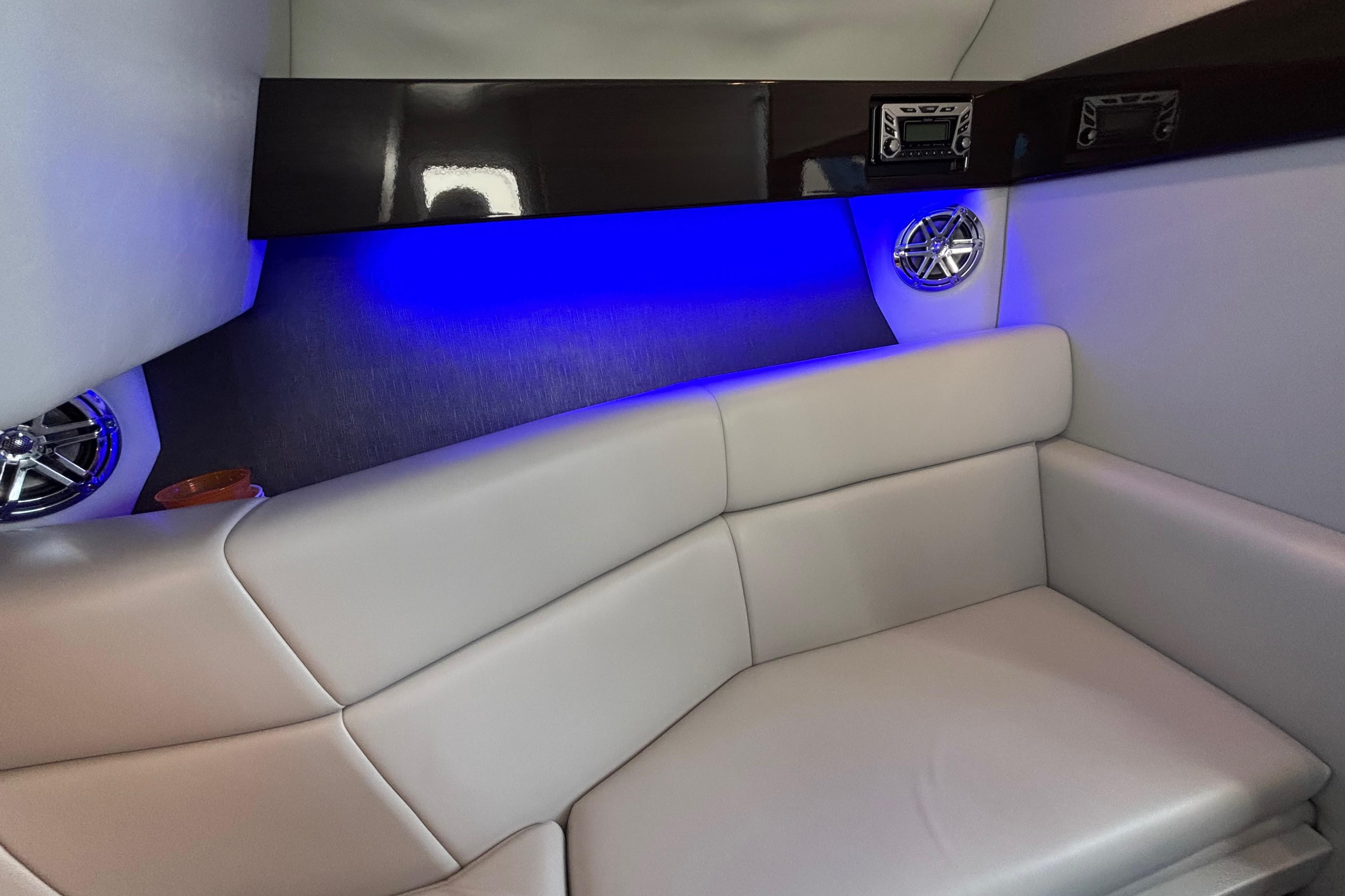 Luxurious interior of 2018 Formula 330 Crossover Bowrider with blue LED lighting and plush seating.