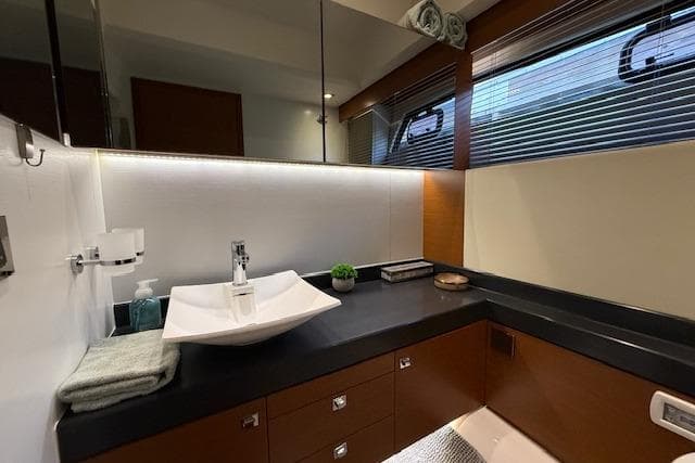 Luxurious bathroom in a 2015 Prestige 500 yacht, featuring modern fixtures and elegant design.