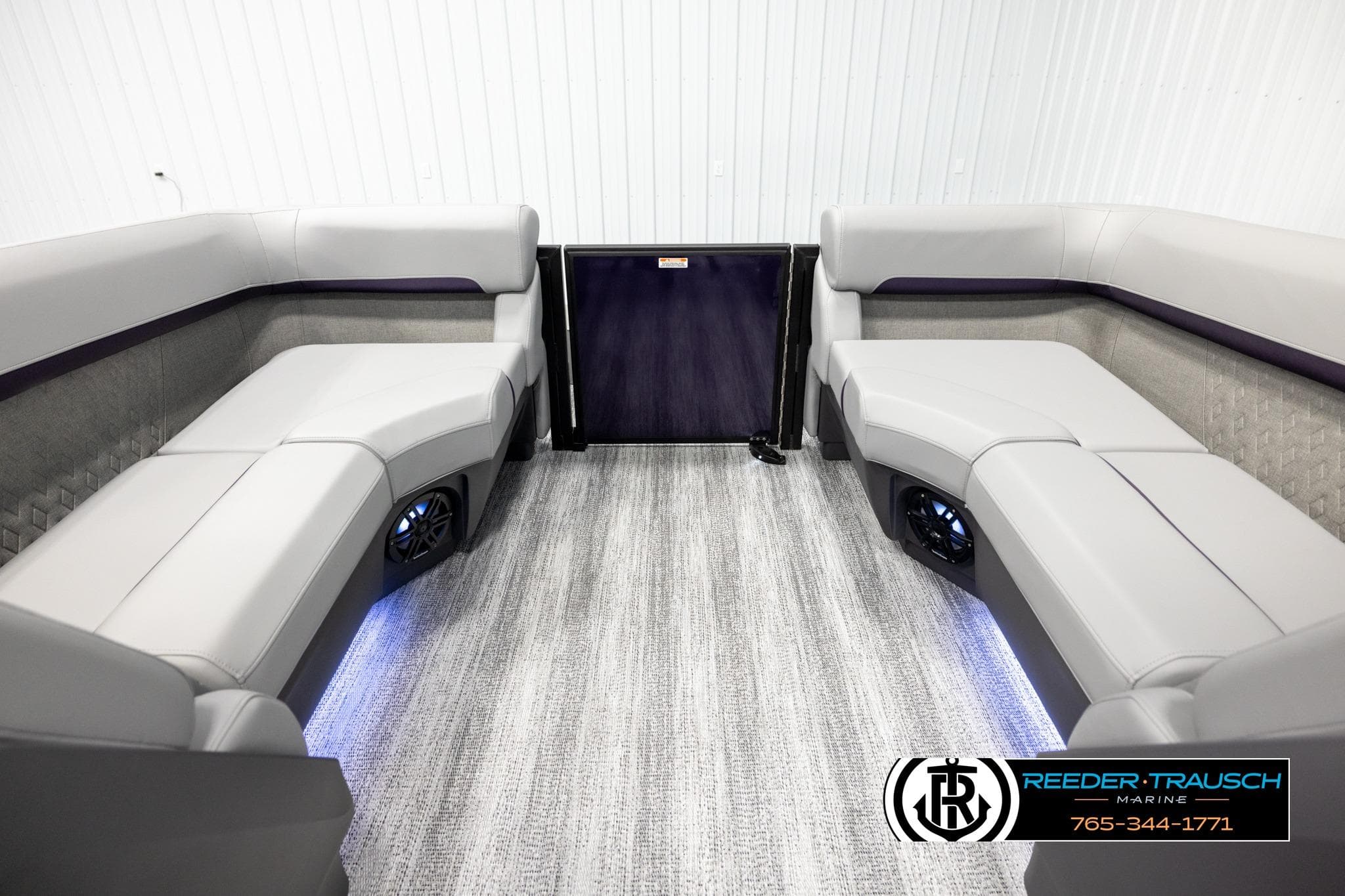 2026 Bennington 22 MFBSE boat interior with plush seating and ambient lighting.
