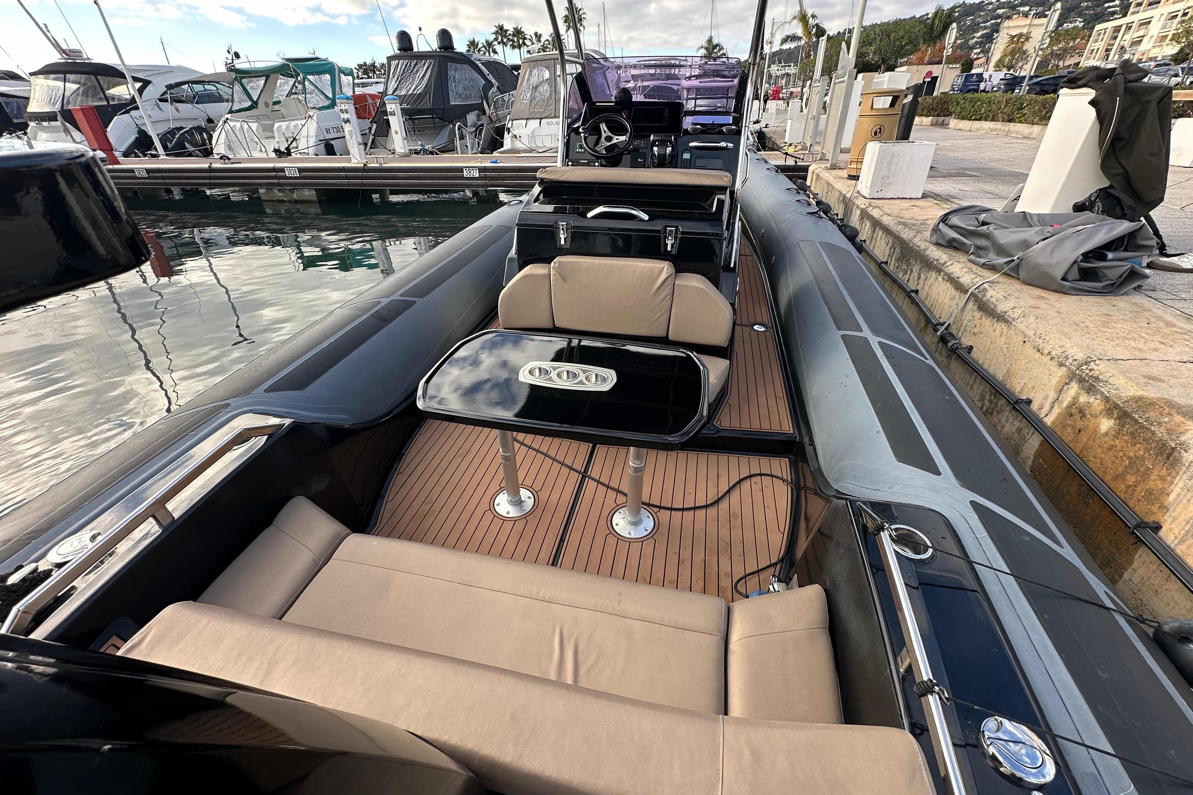 2018 Brig Eagle 10 boat with seating and table, docked at marina.