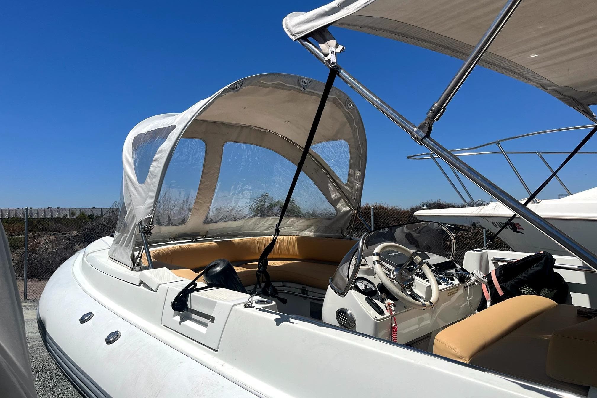 2016 Castoldi jet tender with canopy and seating, docked under clear blue sky.