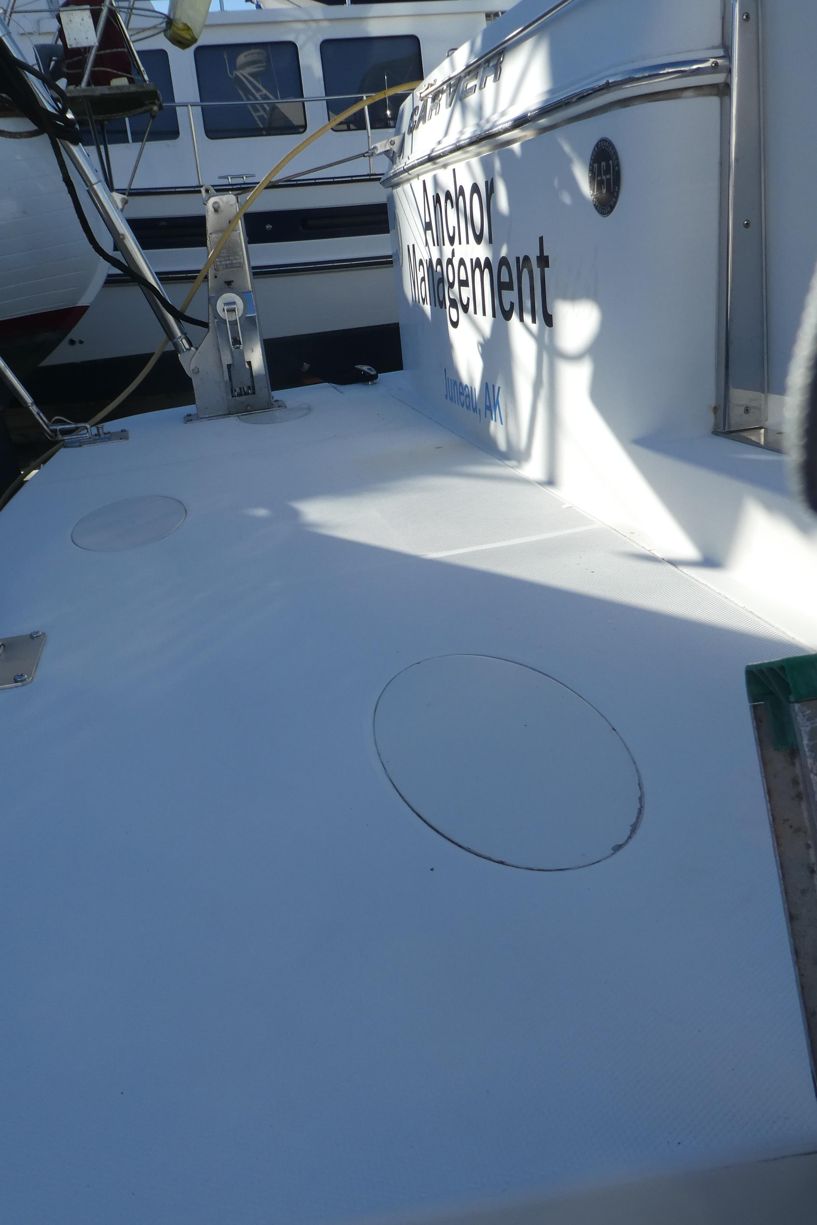 2005 Carver 38 Super Sport boat deck with visible name, docked in marina.
