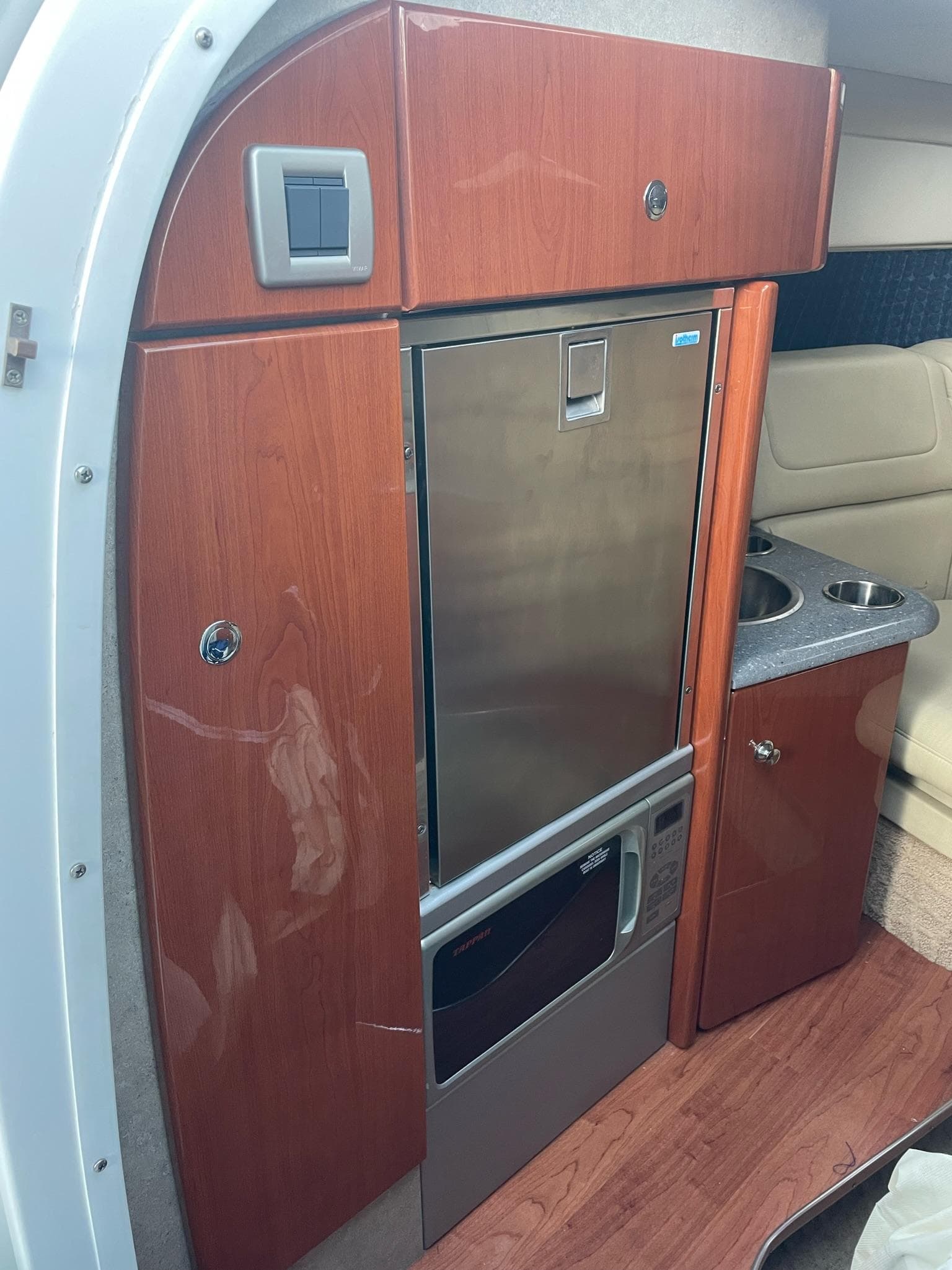 Interior of 2007 Formula 310 Sun Sport with wood cabinetry.