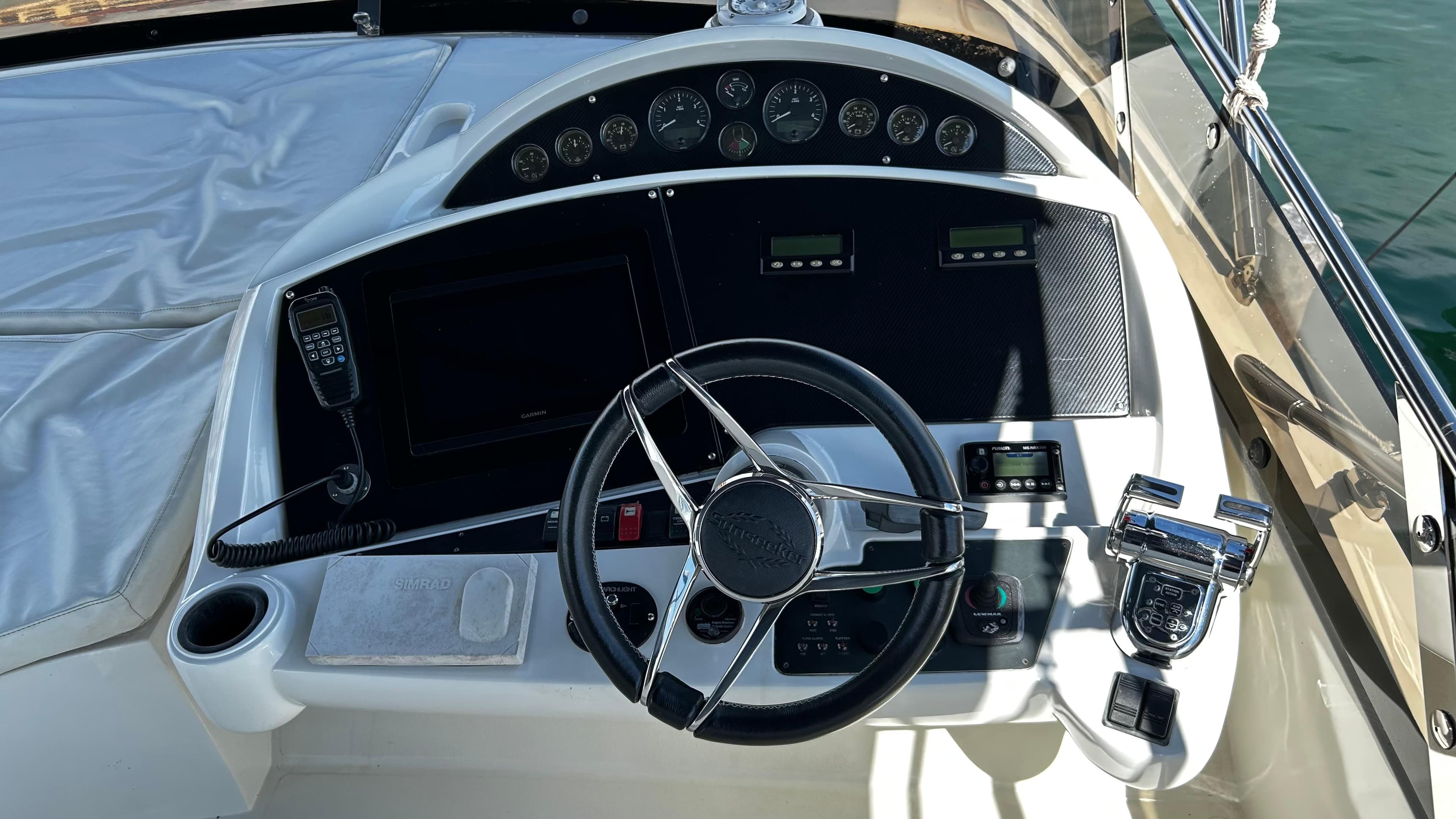 Cockpit of 2006 Sunseeker Manhattan 60 yacht with steering wheel and control panel.