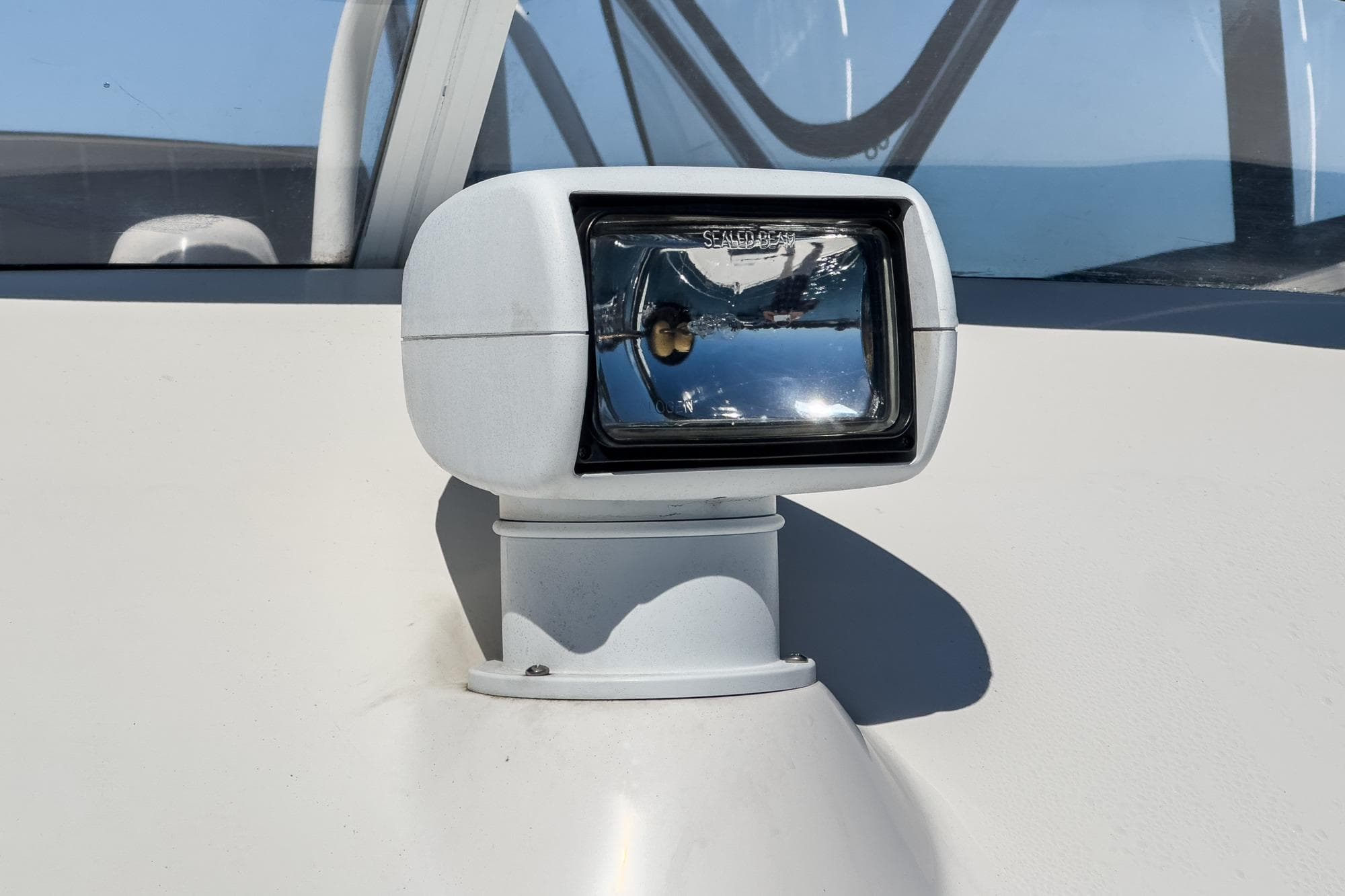 Close-up of a spotlight on a 2006 Riviera 33 Flybridge boat.