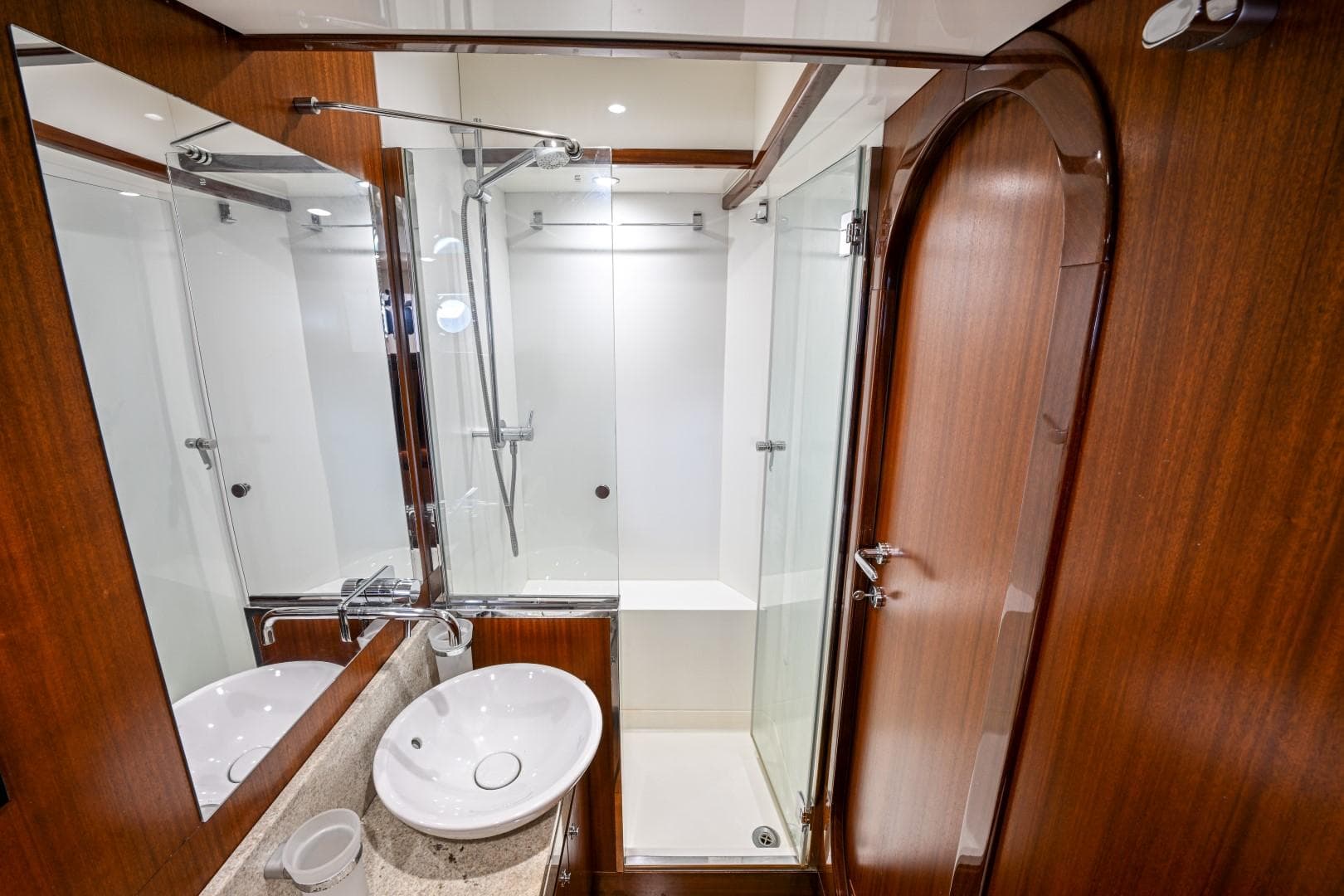 Luxurious bathroom on 1978 Schooner 22m Cantiere Stain yacht with wood accents and modern fixtures.