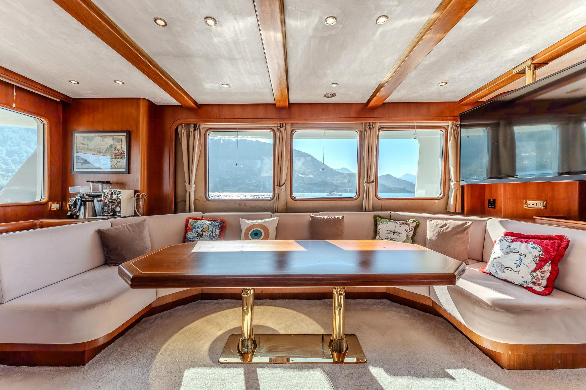 Luxurious 2013 Motor Yacht interior with elegant seating and panoramic windows.